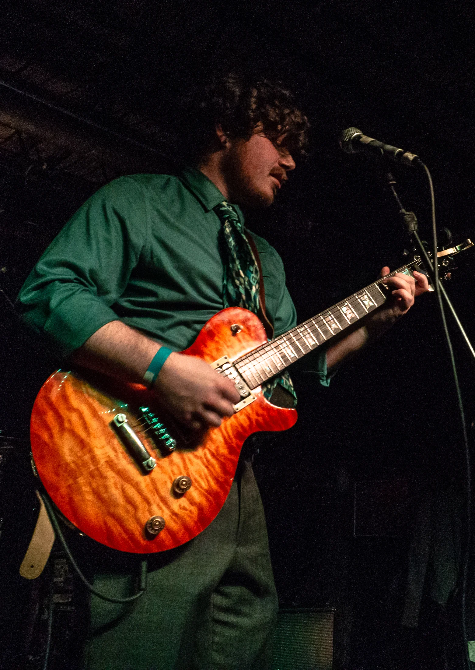 Peter Dressel, vocalist and rhythm guitarist, performing at Gabe’s Oasis in Iowa City. Photo by Melinda Ehrp