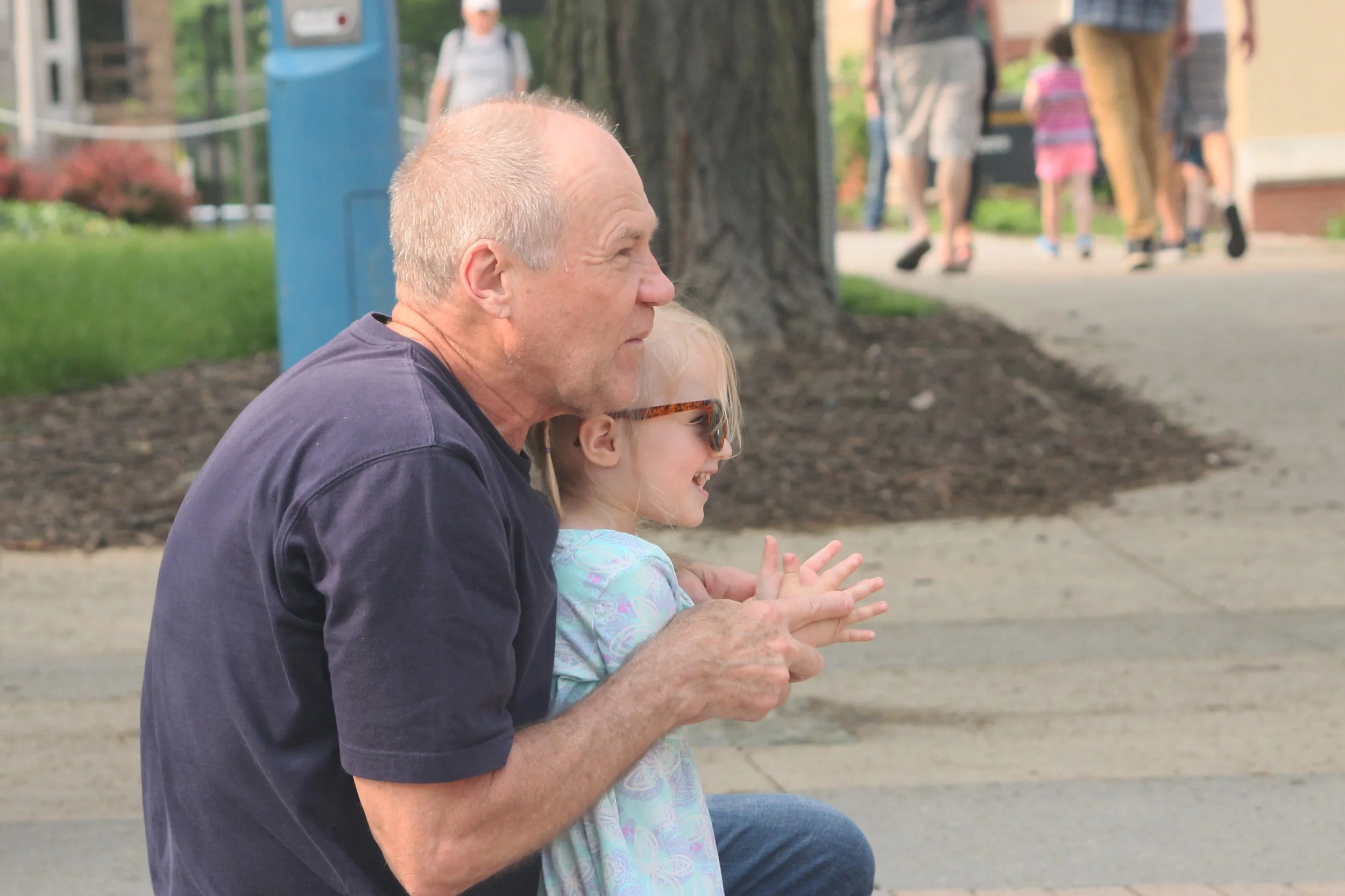 Two festival attendees enjoy a performance. Photo by Lauren Arzbaecher