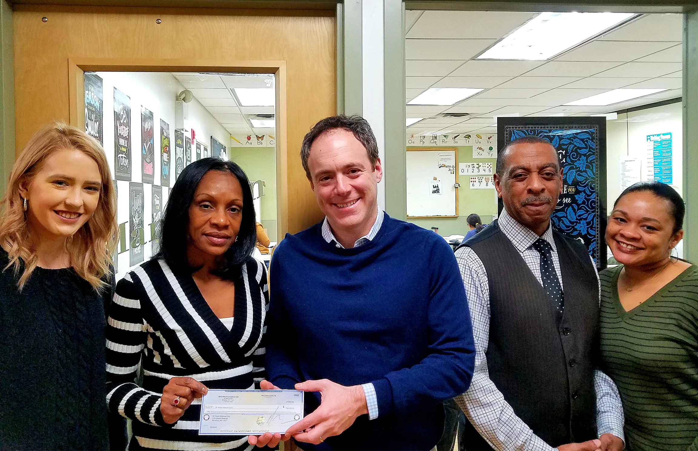 Pictured with David Lombino from left: Ashley Hickerson, Case Manager; Beatrice Brown, First Job Program Manager; Milton Brown, Job Readiness Trainer; and Dominic Savage, Transformational Coach.