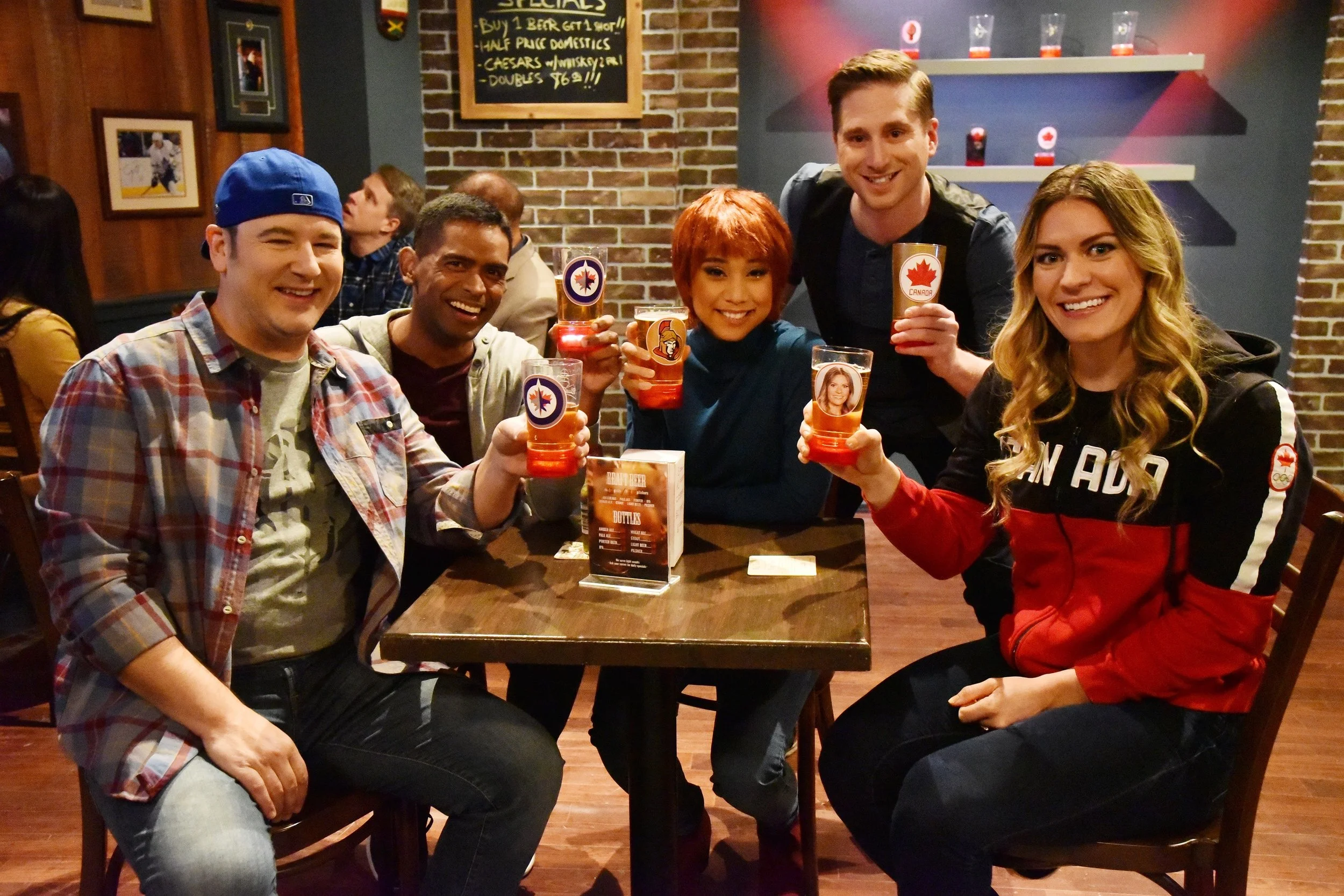 In a very special guest appearance, Canadian Olympian Natalie Spooner stops by a neighbourhood bar to stick-handle questions from some die-hard sports fans.