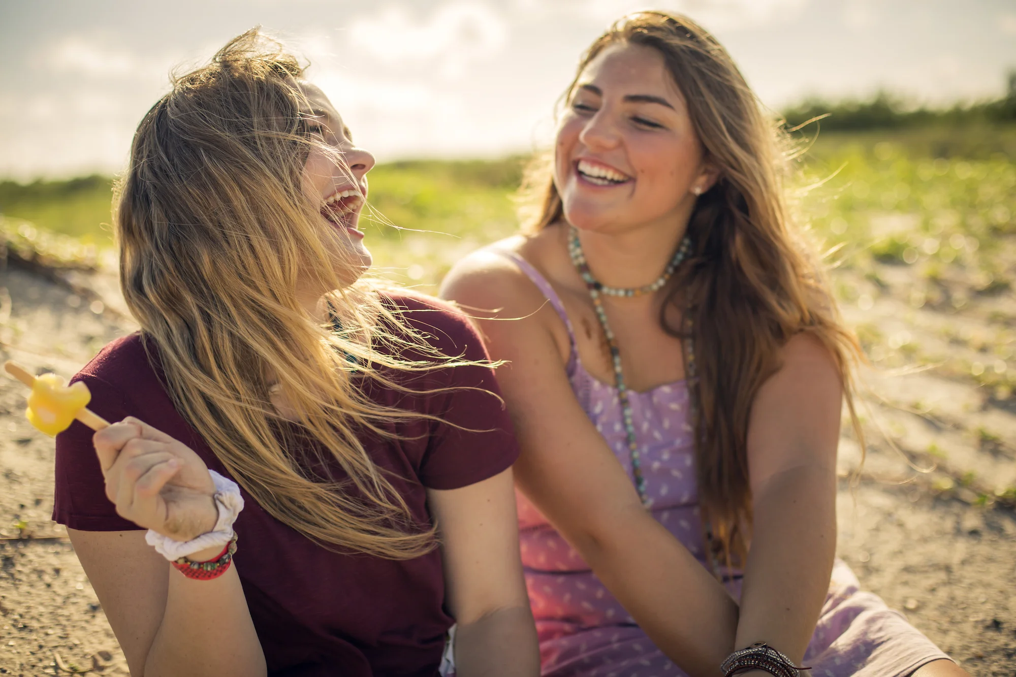 girls-laughing-beach-sundown-ice-cream.jpg