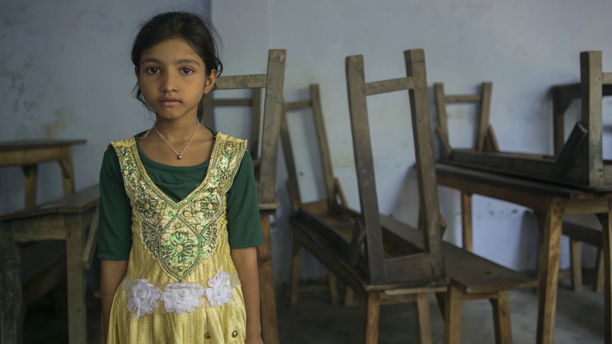 girl-stares-tables-india-village.jpg