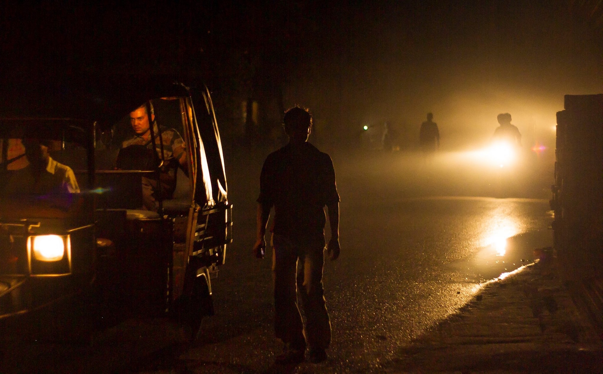 man-headlights-india-village-night.jpeg