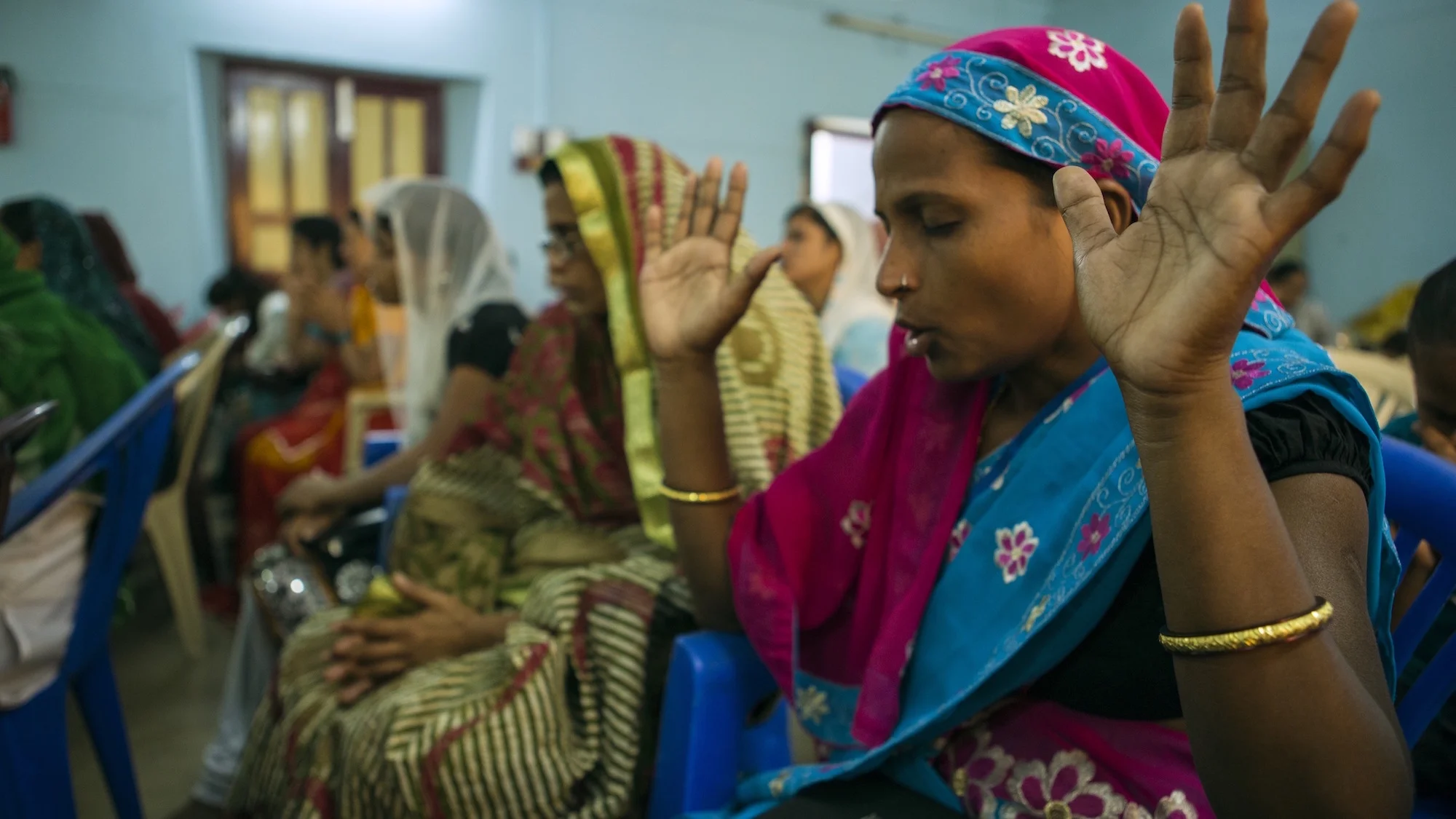 woman-prays-during-service-india.jpg