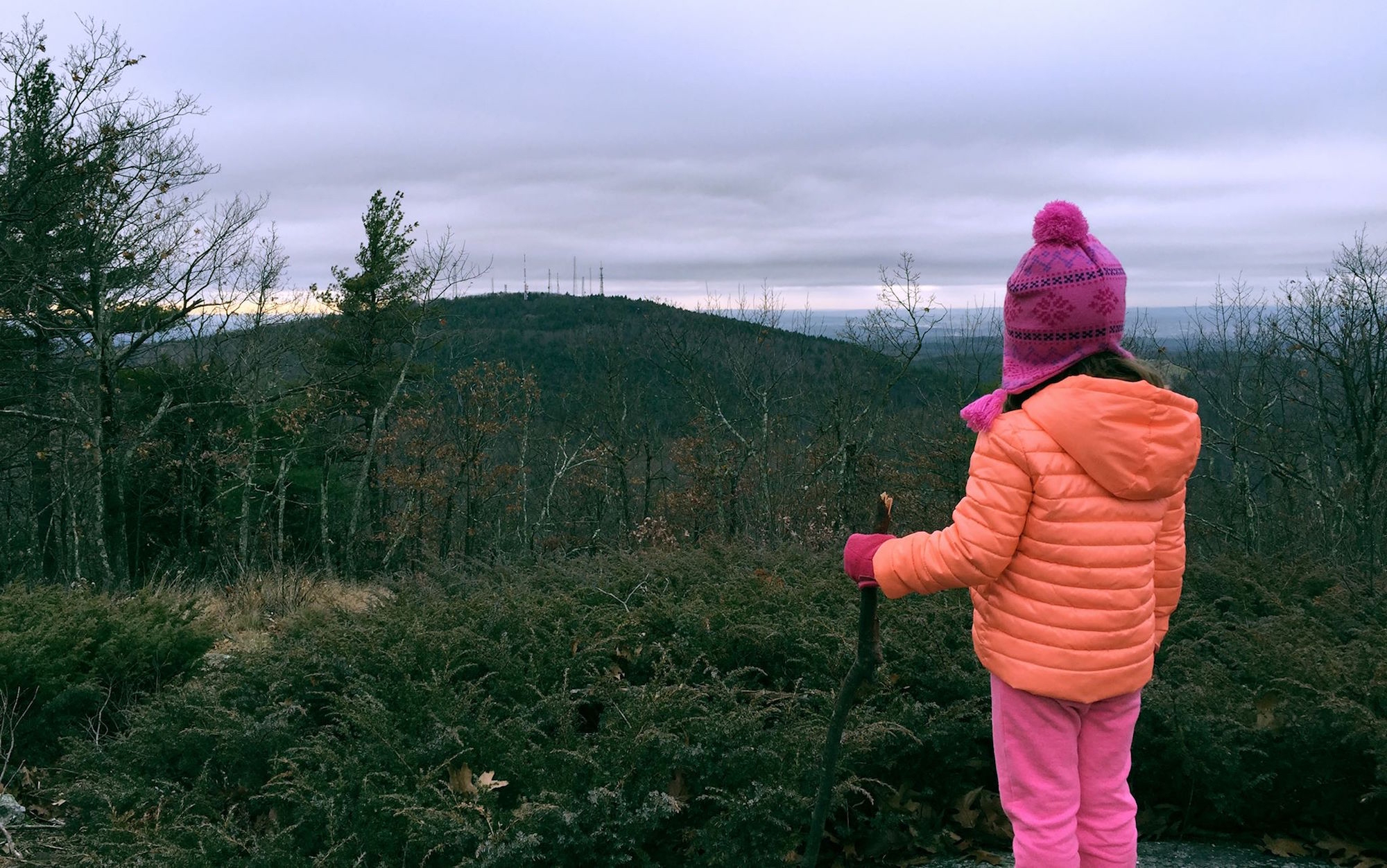 girl-stands-view-hike-mountain.jpeg