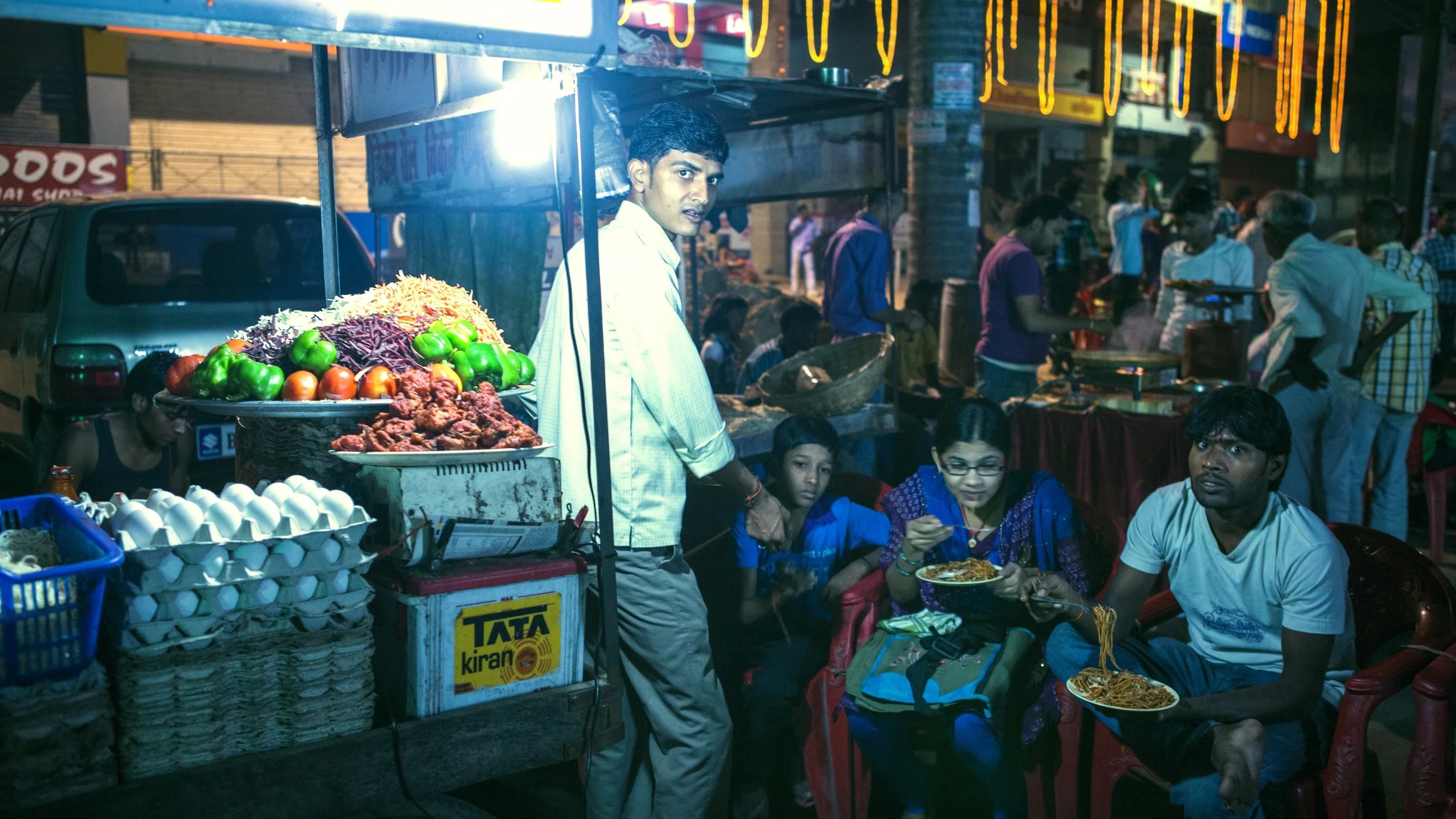 people eating food at festival.jpg