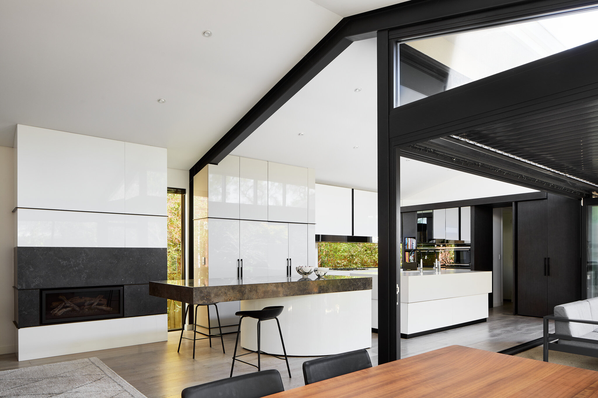 Black and white kitchen raked ceilings Adyn Kelly Spreading Roomers.jpg