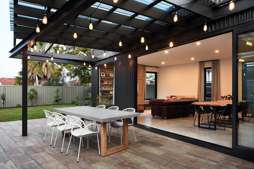 Black patio garden alfresco with festoon lighting