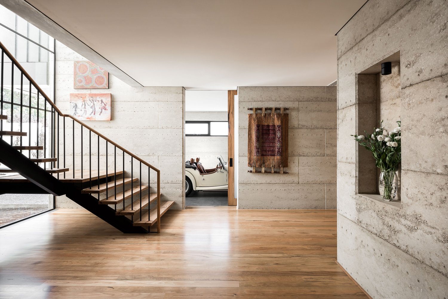 Rammed earth and feature staircase Keen Architecture.jpg