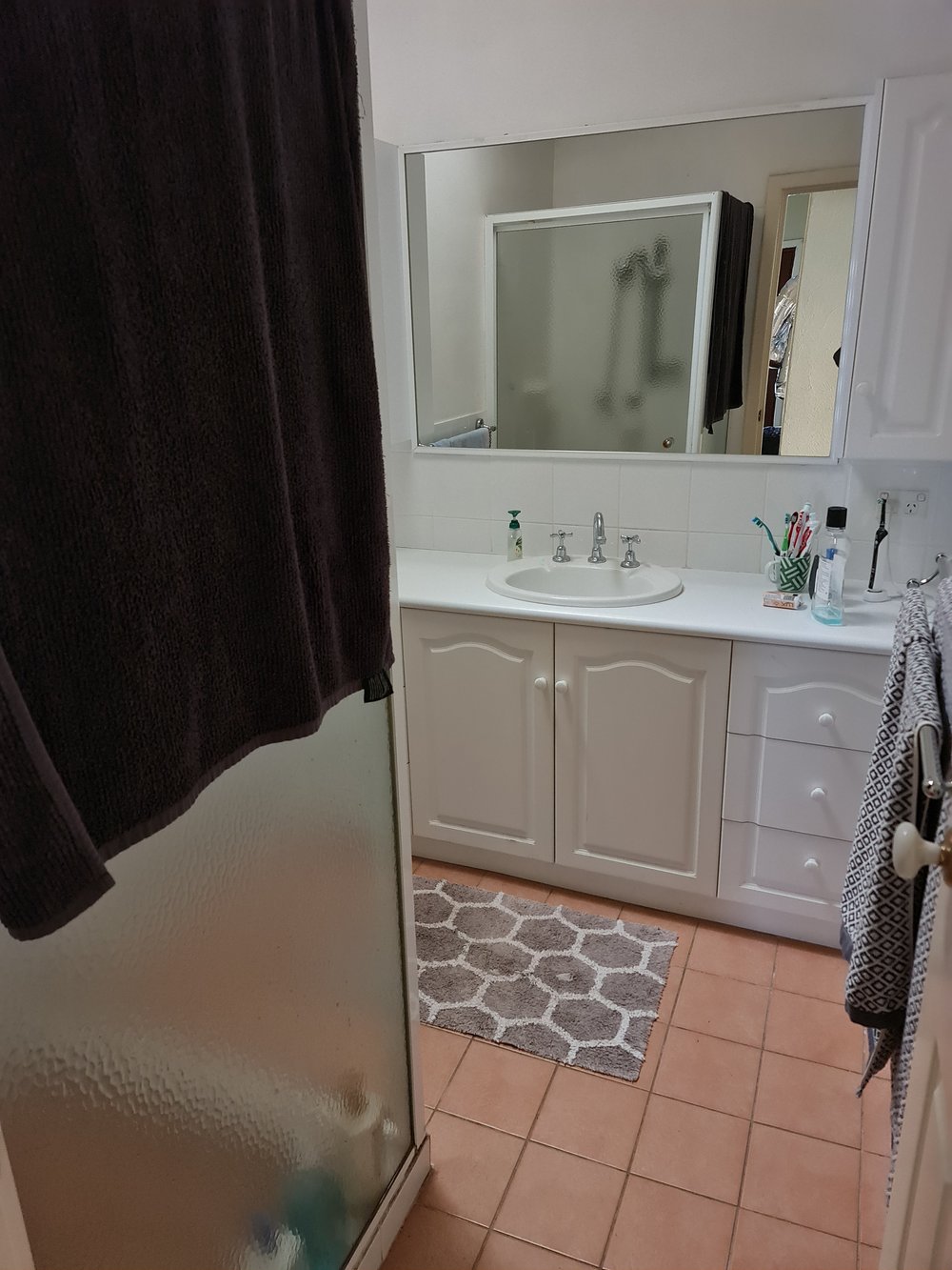 dated cream bathroom before renovation