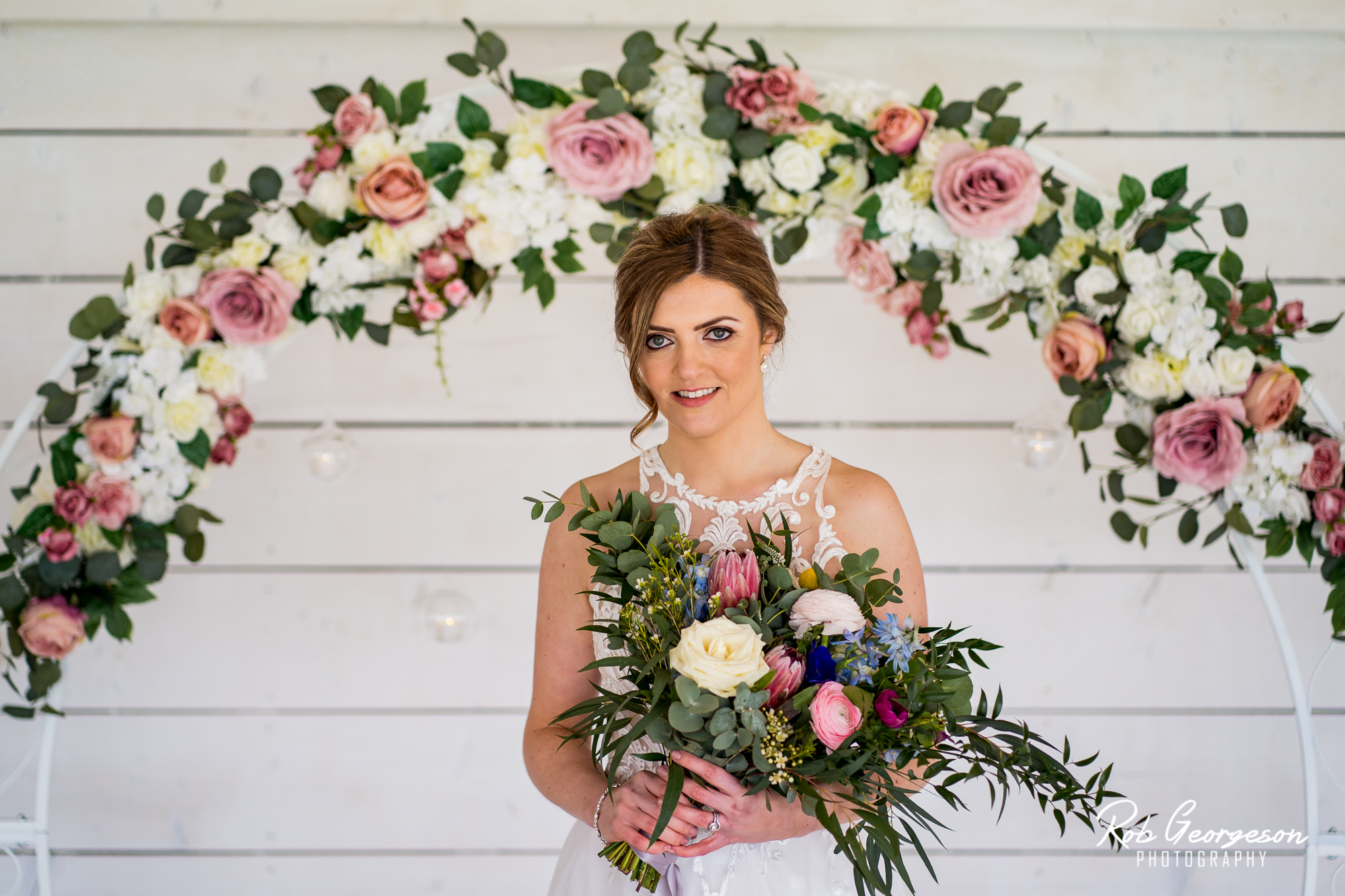 bride with her bouquet and flower ring