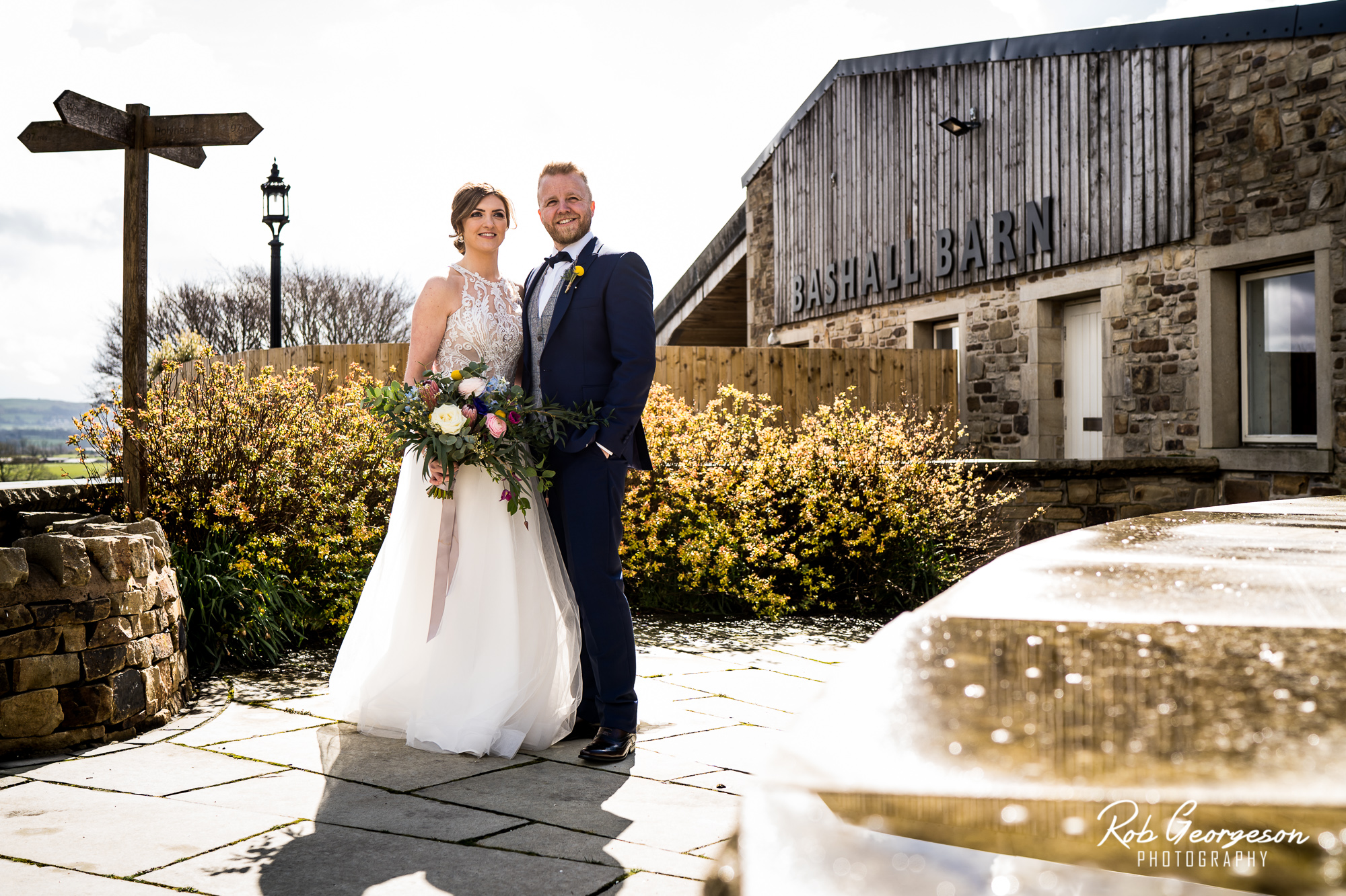 bride and groom at the cow shed at bashall barn