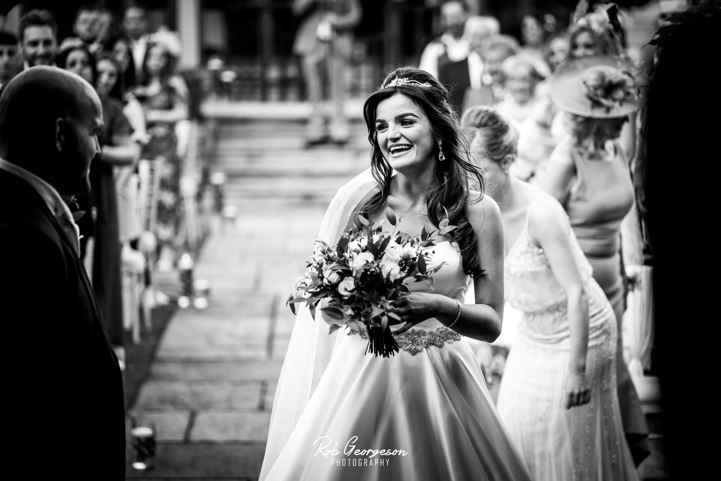bride smiles at the groom 