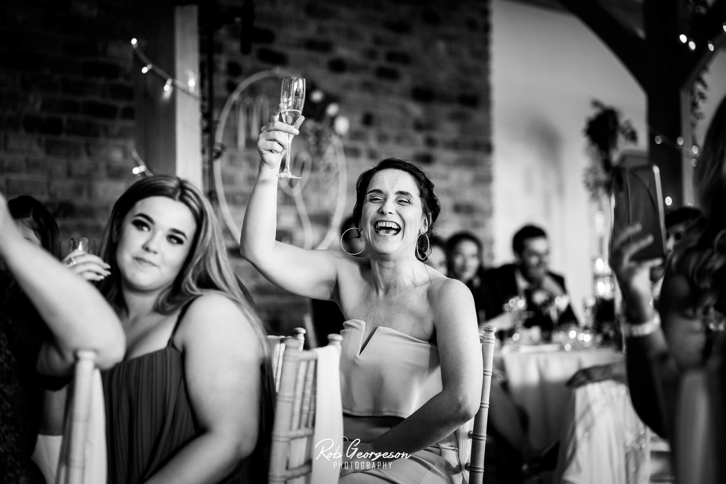 wedding guests toast the happy couple 