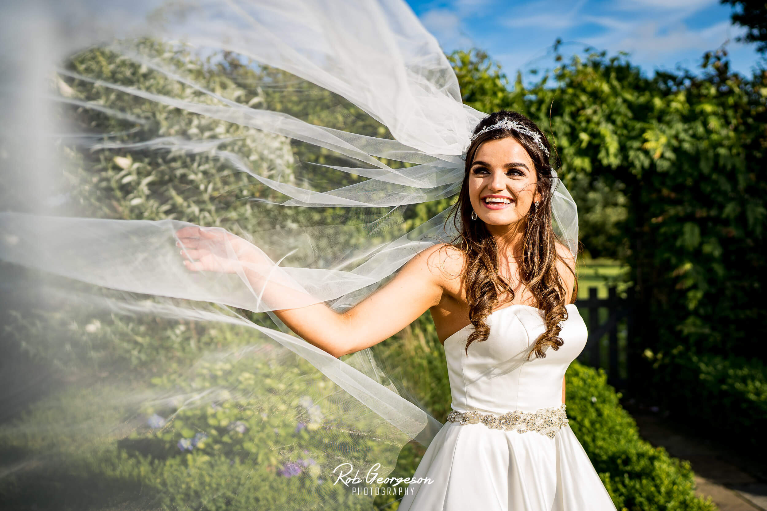 Miss Wales bride with veil in wind 