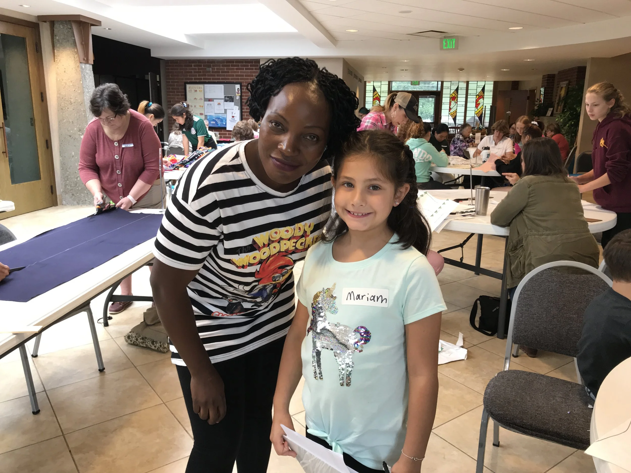 Phoebe and a young volunteer at the Calvary Methodist Church MoonBee a few weeks ago.