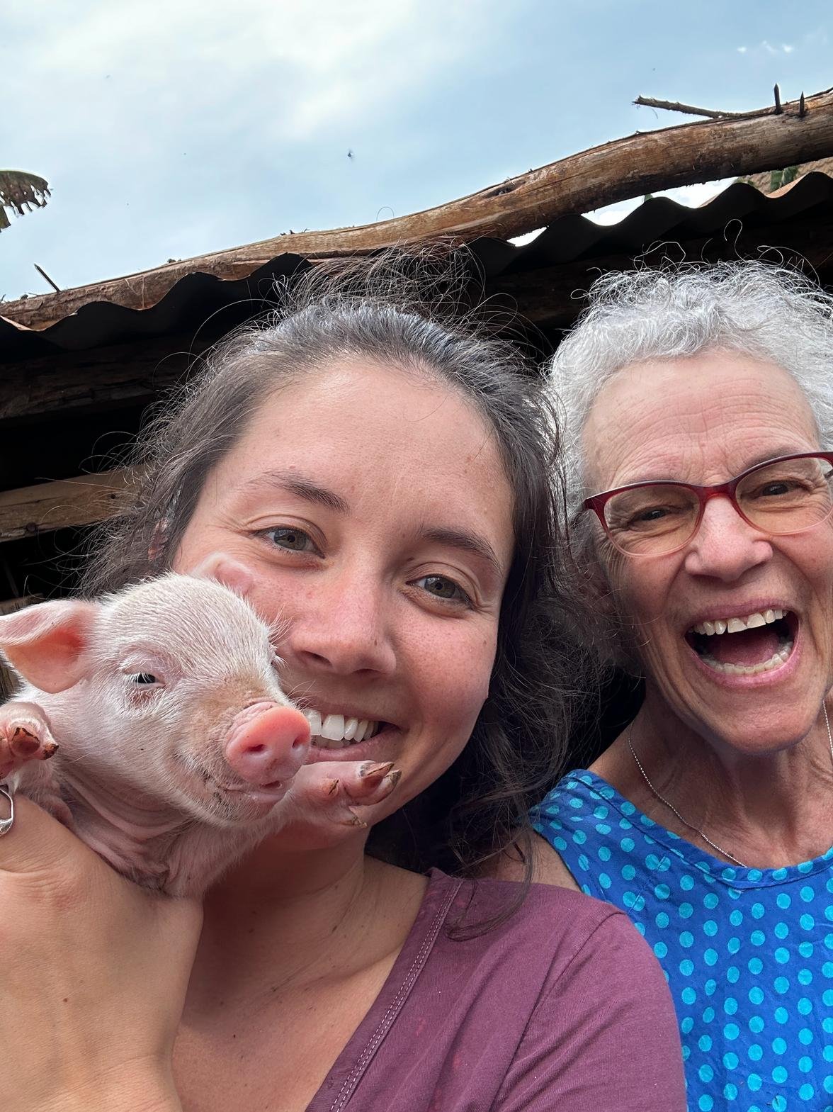Charlotte and Ellie with piglet.jpg