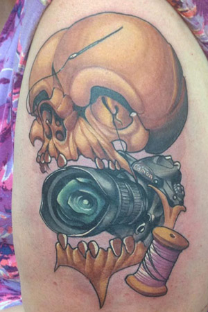 This tattoo symbolized me. I need to add to it to add more of ME to it. But in time. The two main things that fill my head (thus the skull) are my photography and my sewing. It's not a girlie tattoo. I know that. I am NOT a girlie girl. That's just not me, Never going to be.
