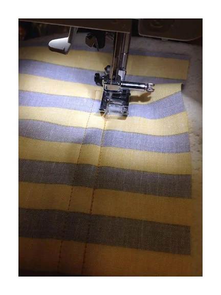 Now sew a 1/2 inch wide rectangle about 1.5 - 2 inches from the top of the pocket piece and 1 - 1.5 inches from each side.