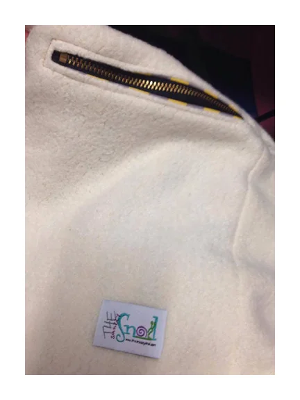 Now with your pocket lining nice and flat stitch a tag inside the jacket lining about 2 inches from the bottom of the pocket lining to hold it nice and flat and in place. This prevents your pocket from shifting or pulling out when you use it.