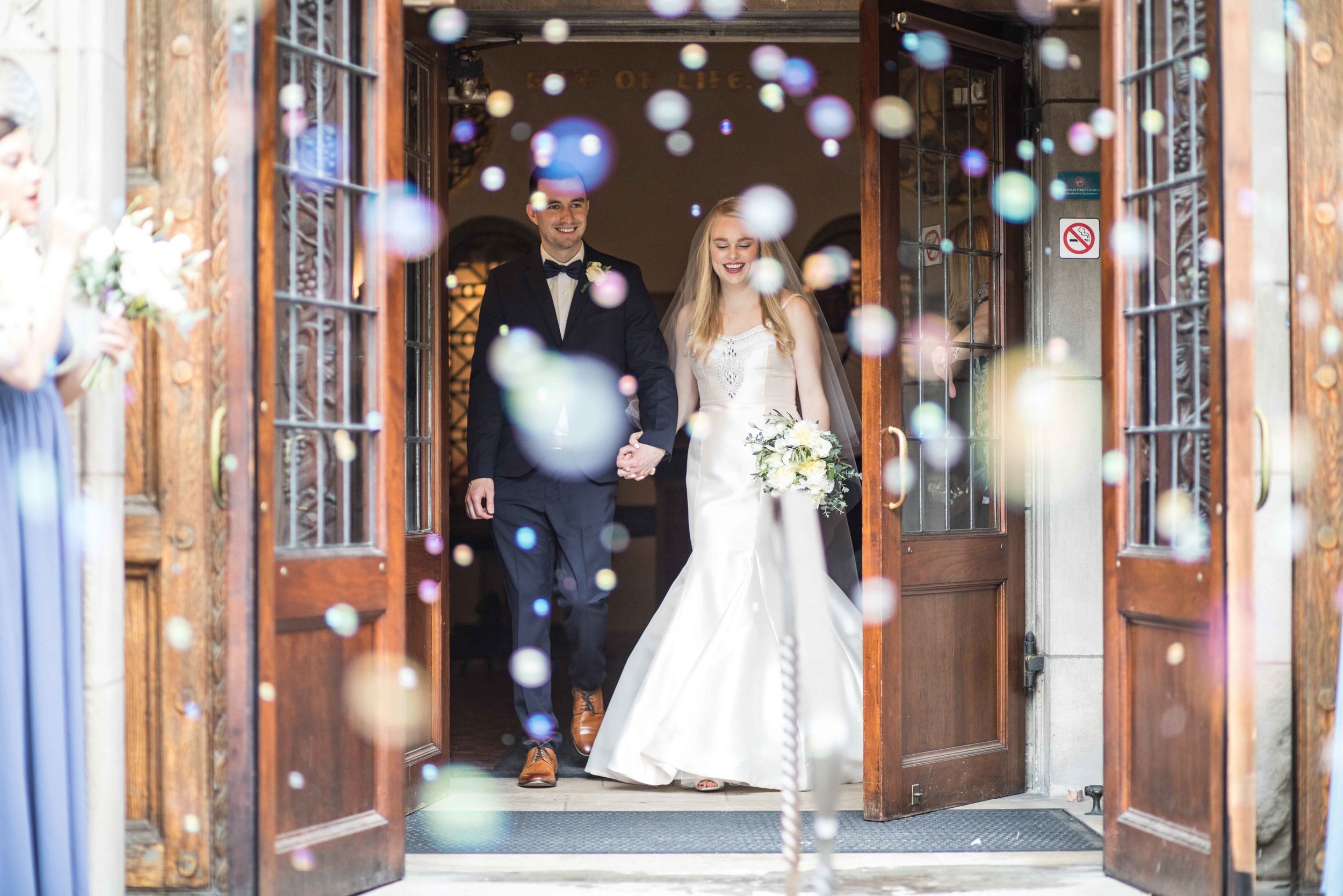  Bride and Groom in a cloud of bubbles 