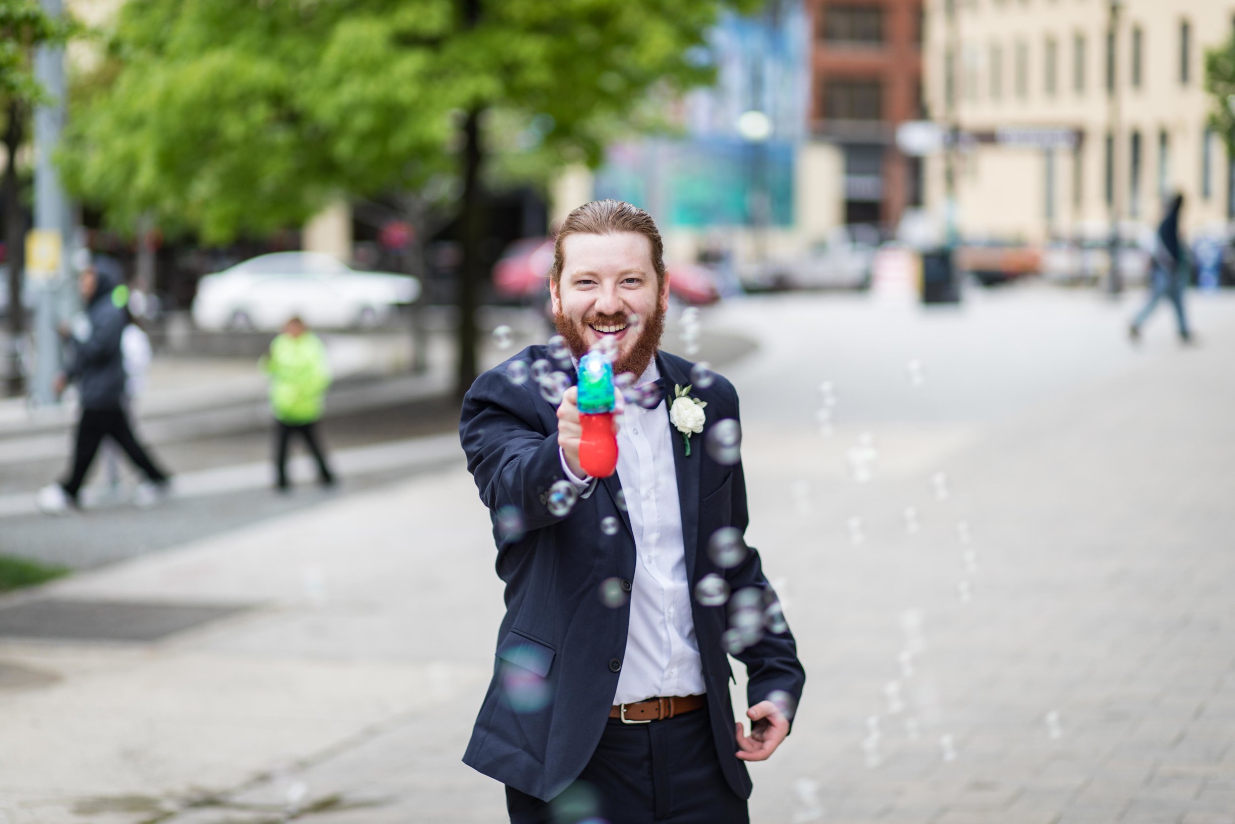  Wedding usher with bubble gun on the streets of Grand Rapids 