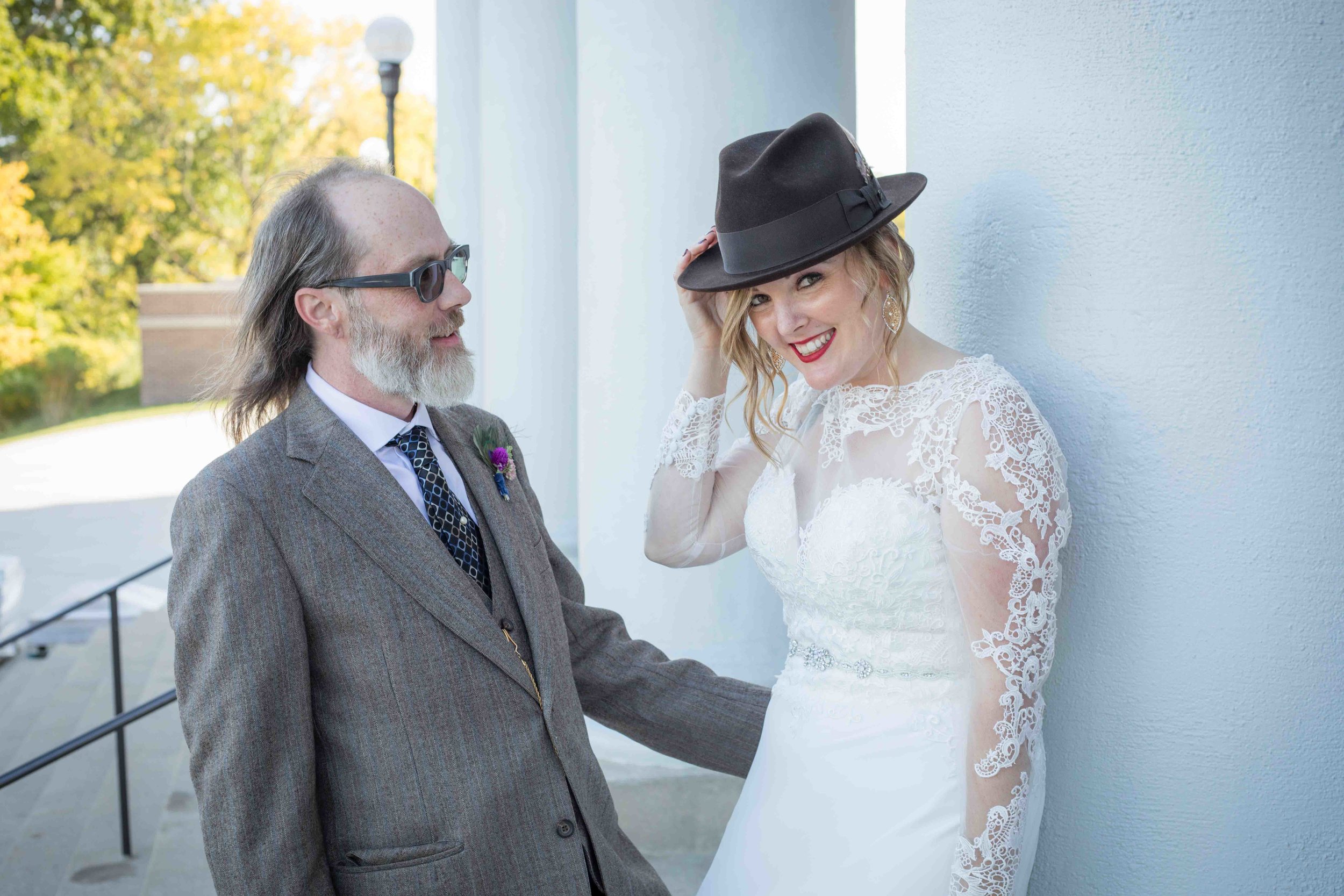  bride and groom having fun during one of their portrait sessions at WMU 