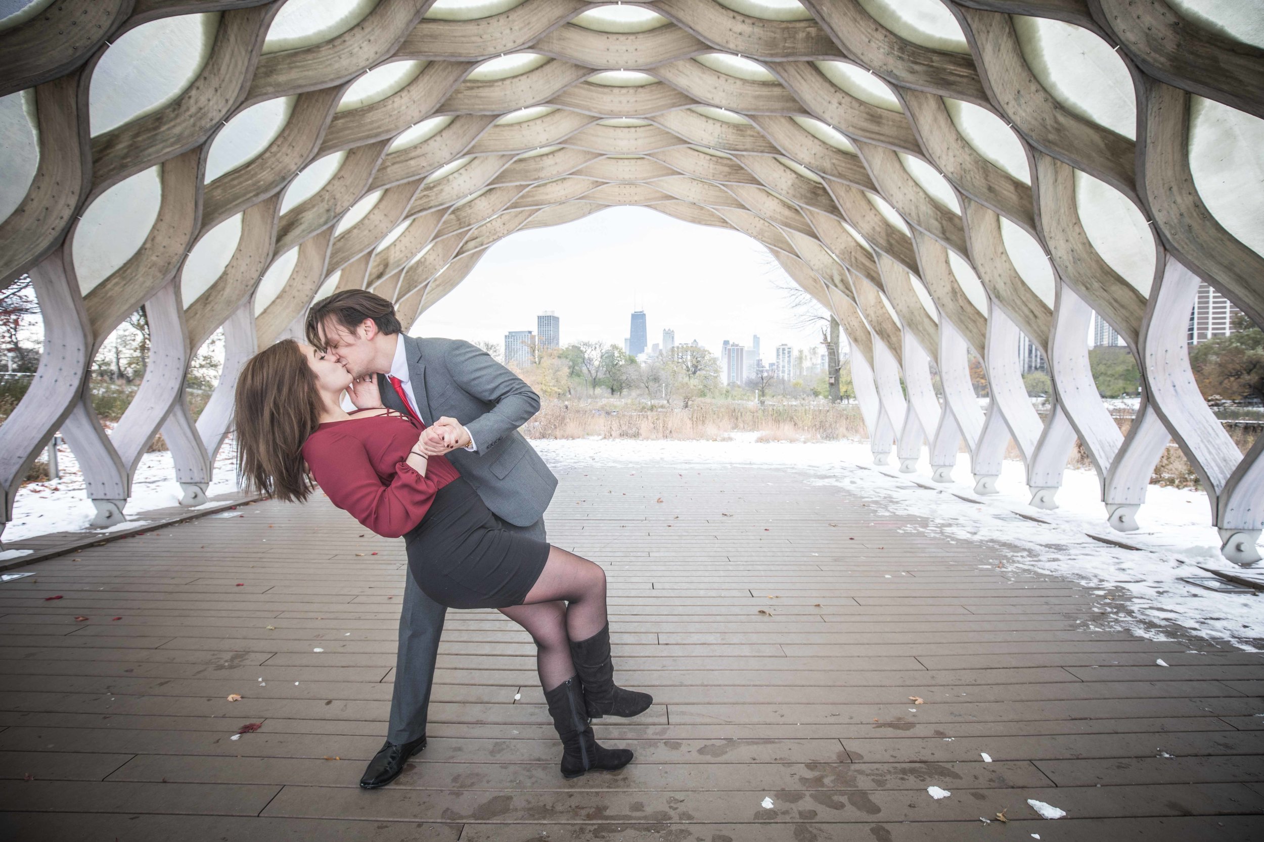 A dip kiss under the wood pavilion in Lincoln Park, Chicago