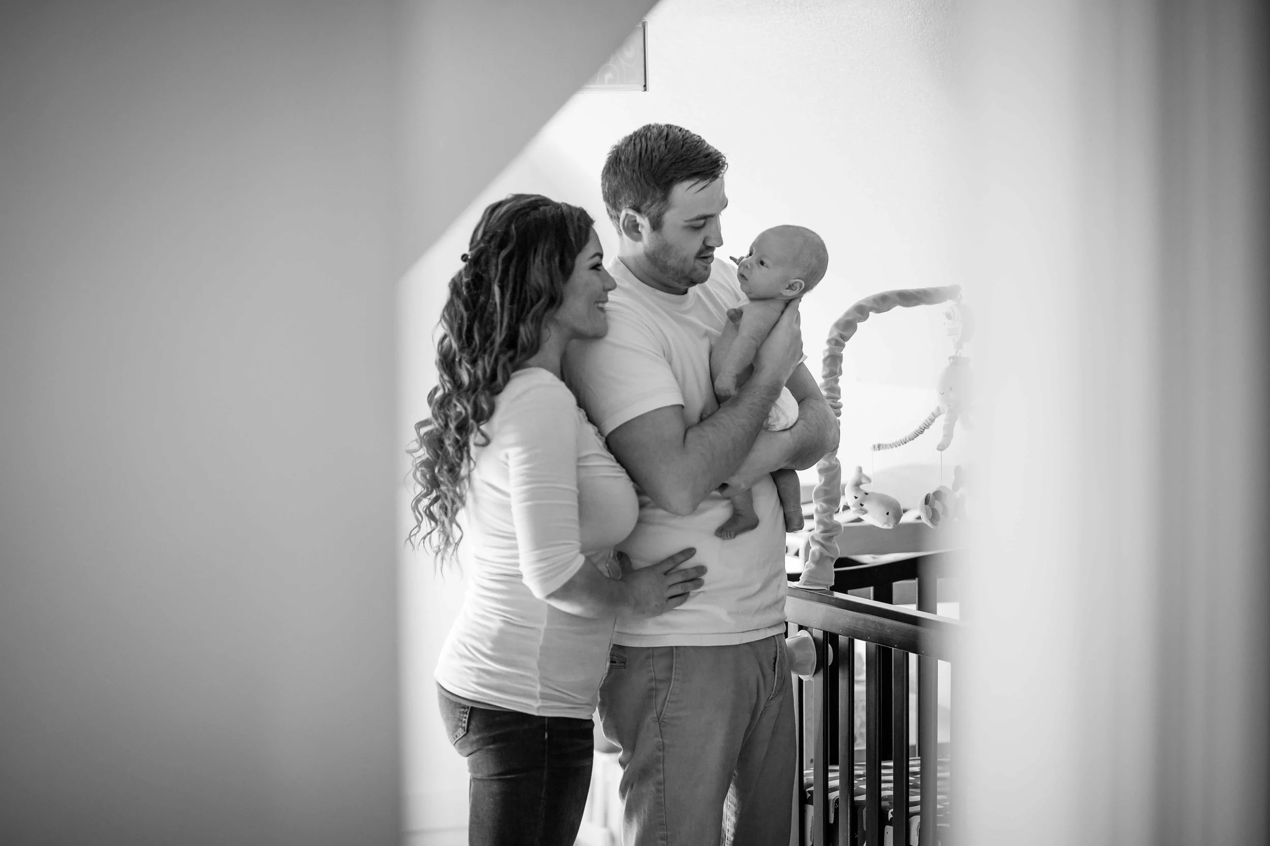 CDP New parents holding their new addition in the nursery .jpg