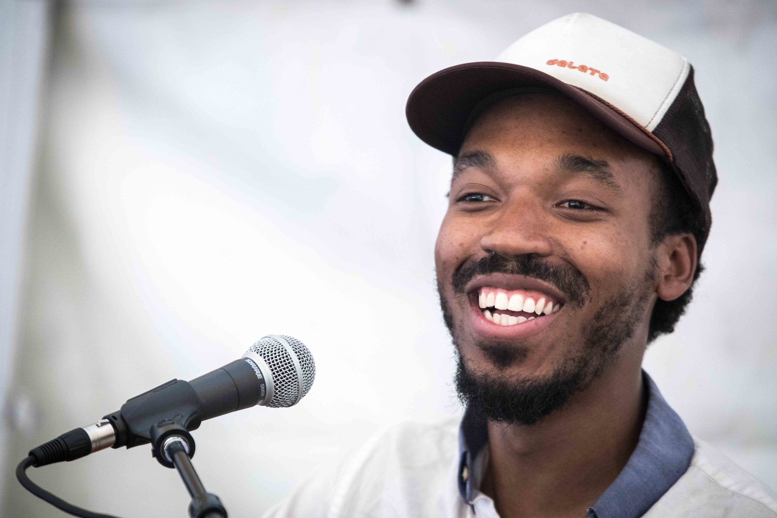  Cellist Jordan Hamilton having a laugh between sets in the tent stage at the Buttermilk Jamboree Music Festival 