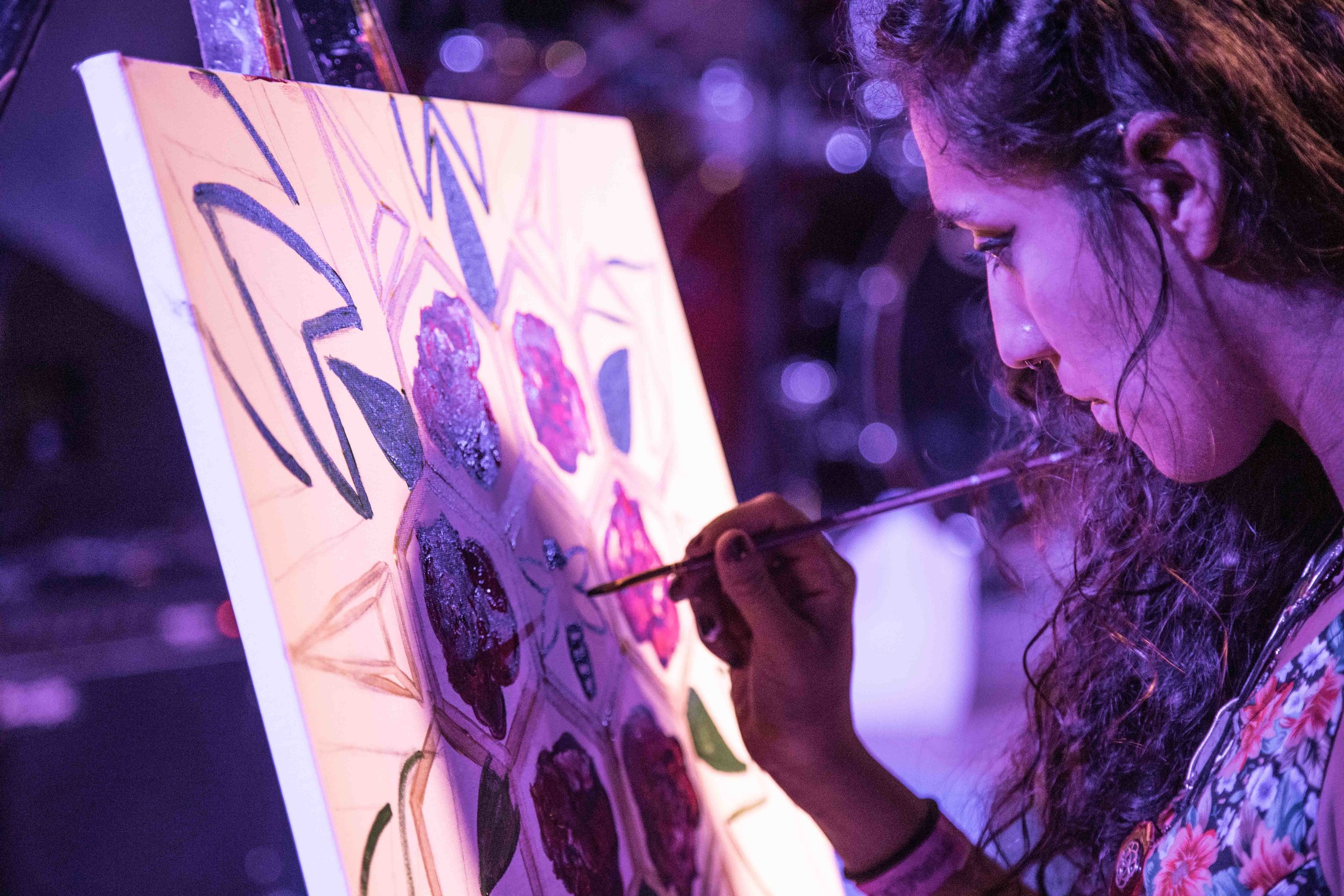  Local Artist paints to live music on stage at the Buttermilk Jamboree event 