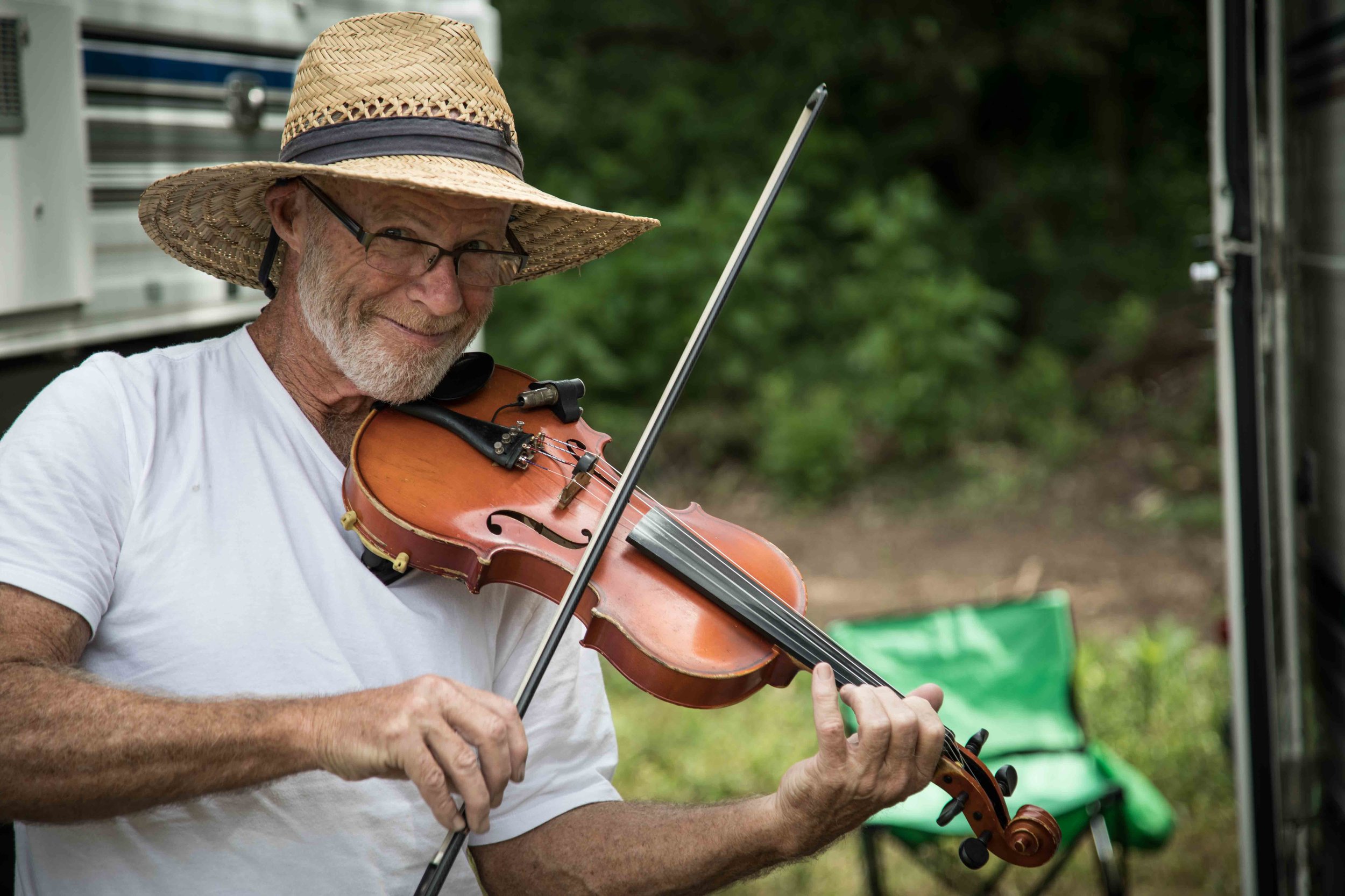  Festival goers bring their own instruments to jam with their tent neighbors 