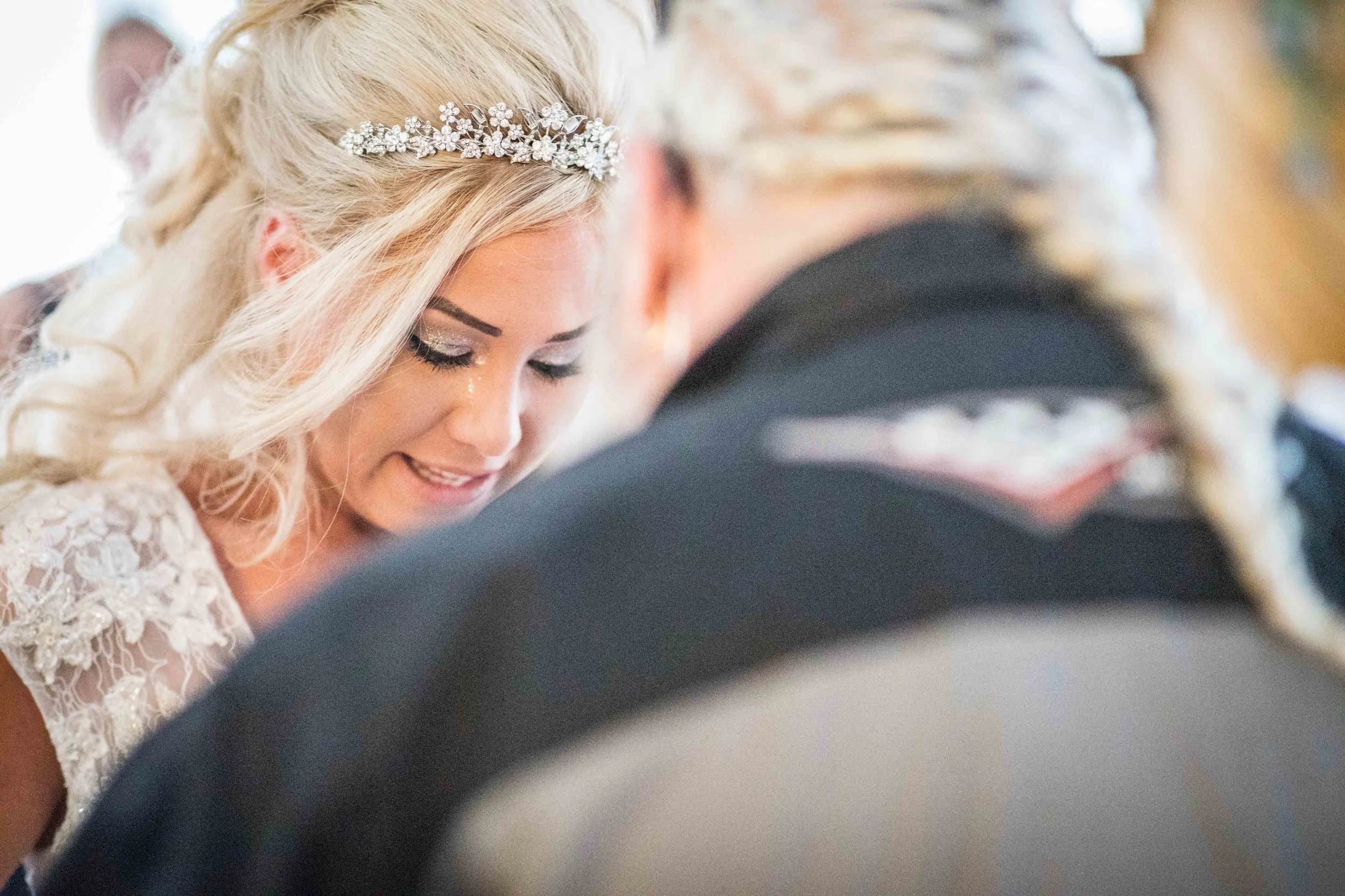 The bride cries as she sees her ill father