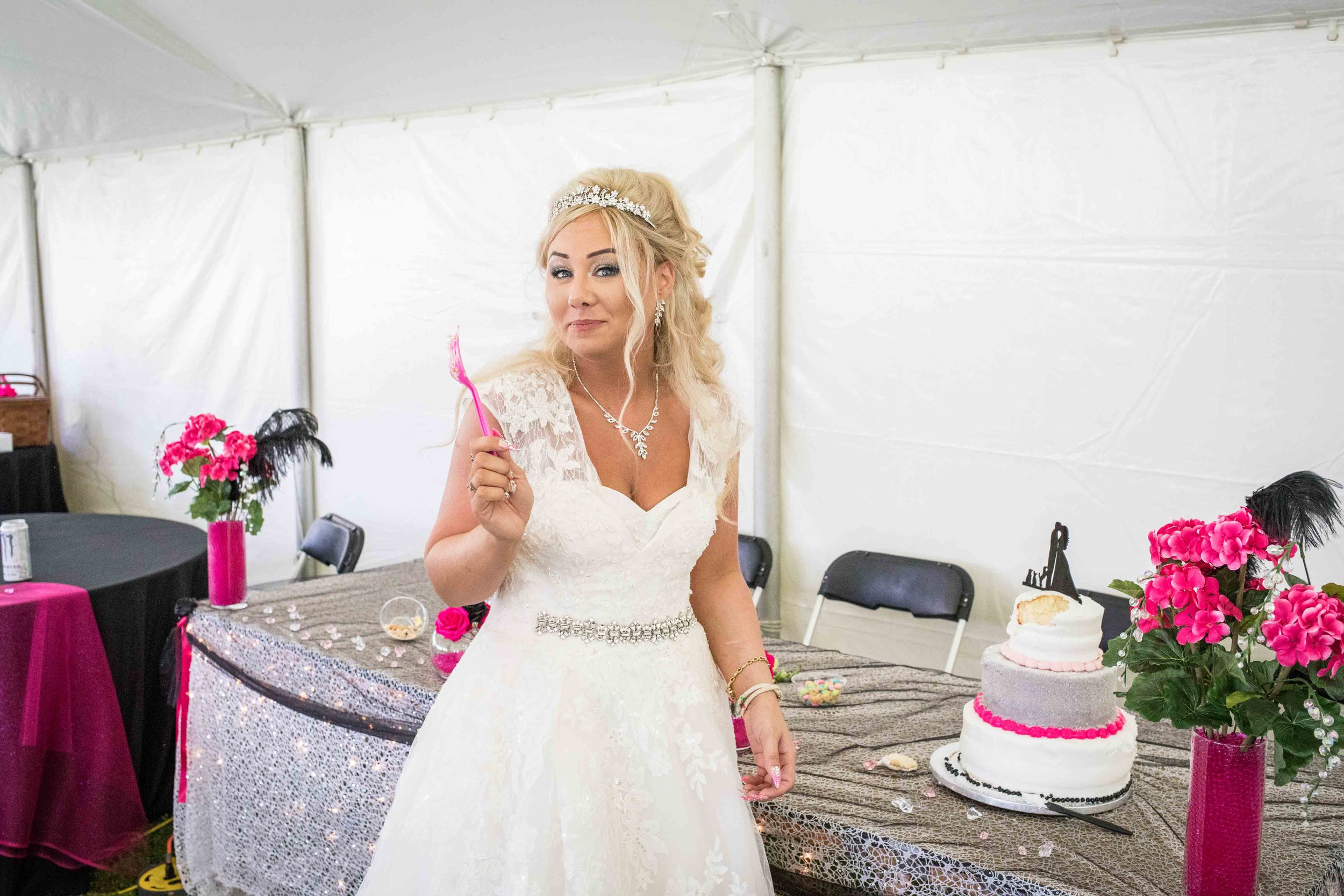  The bride taunts the camera with her pink fork and cake 