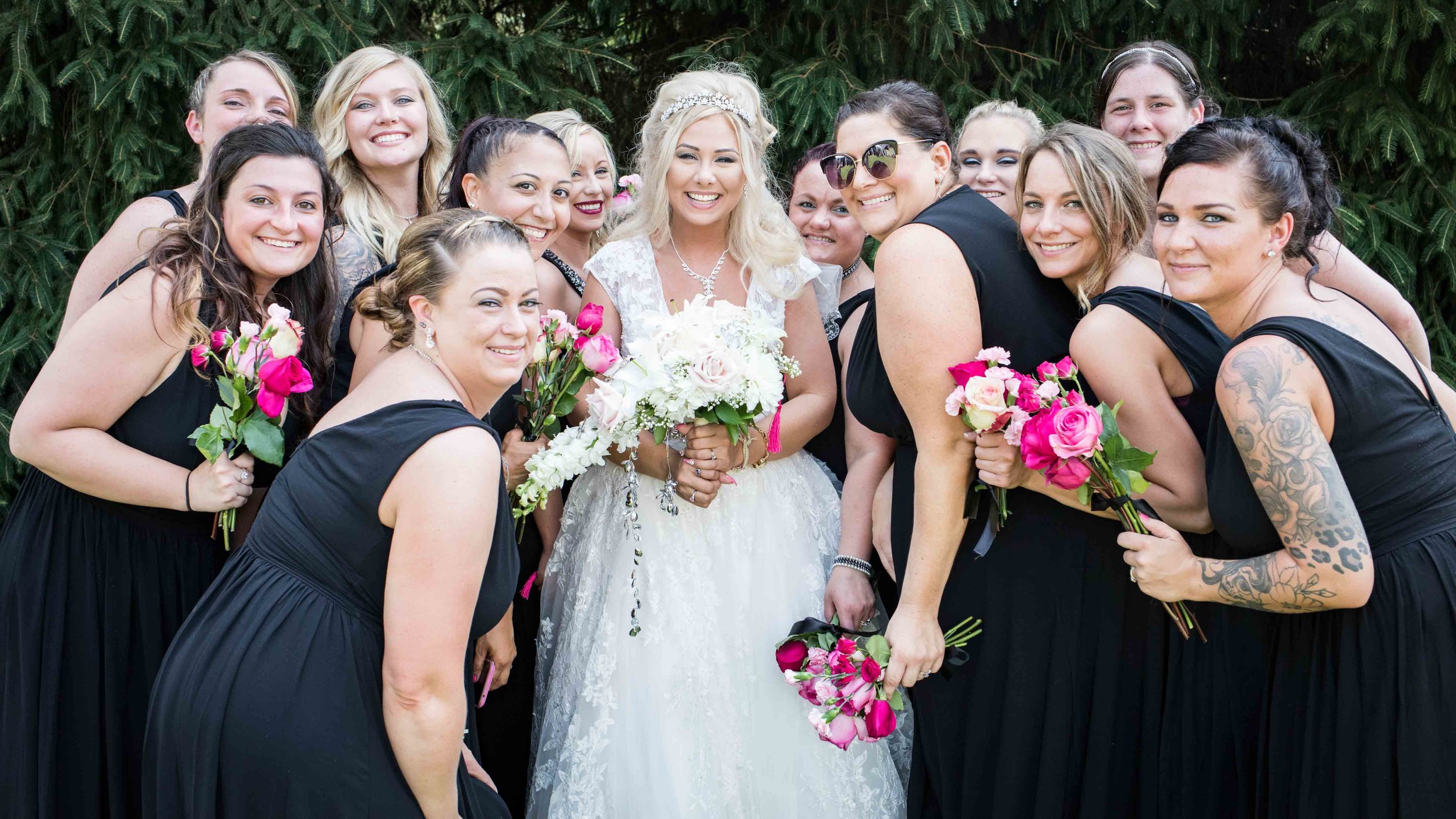  All the bridesmaids bunch together with their flowers for a picture with the bride 