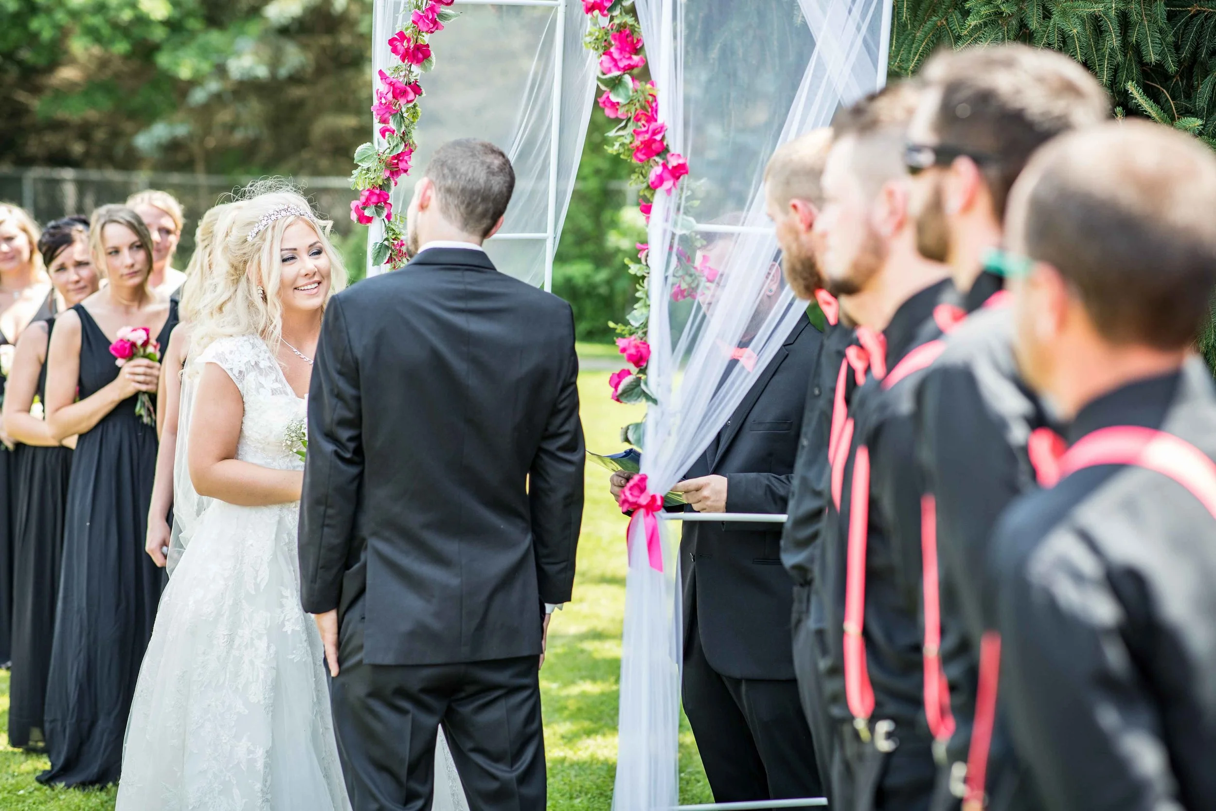 She listens and smiles as he says his vows