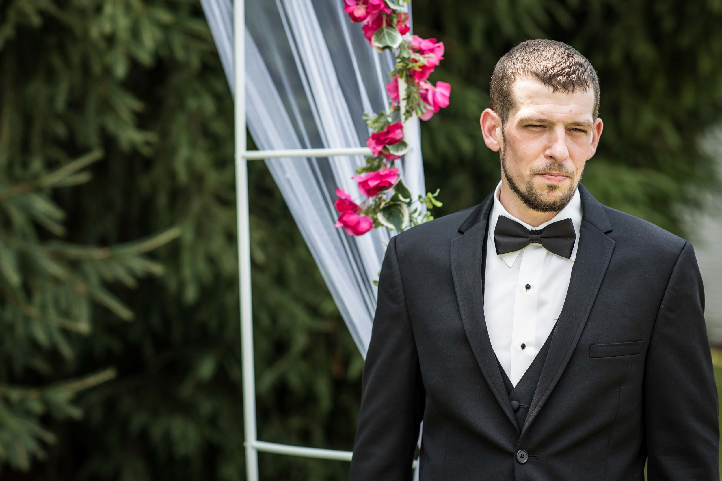  The groom patiently waits for his bride at the beginning of the ceremony  