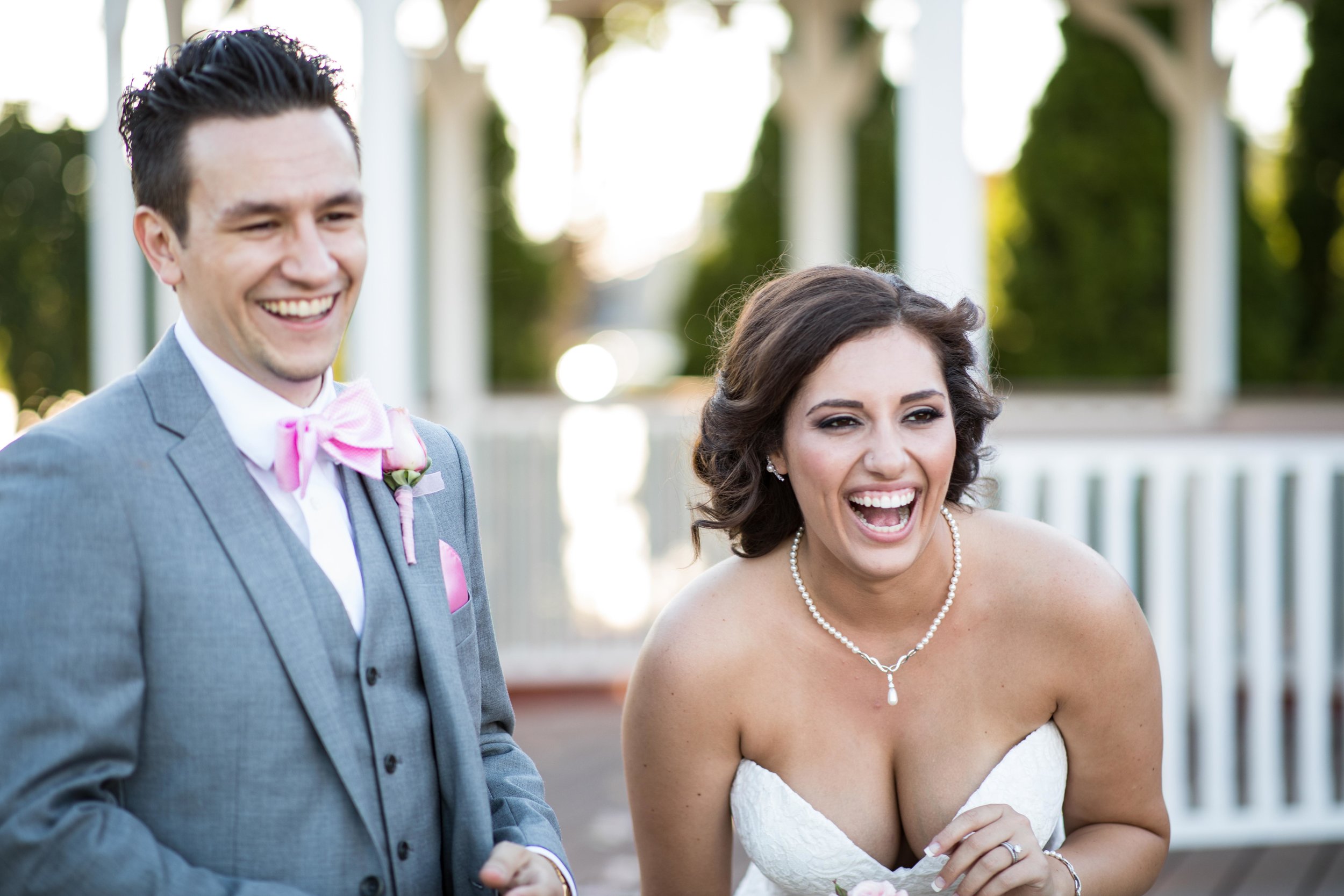 bride and groom laughing during portraits.jpg