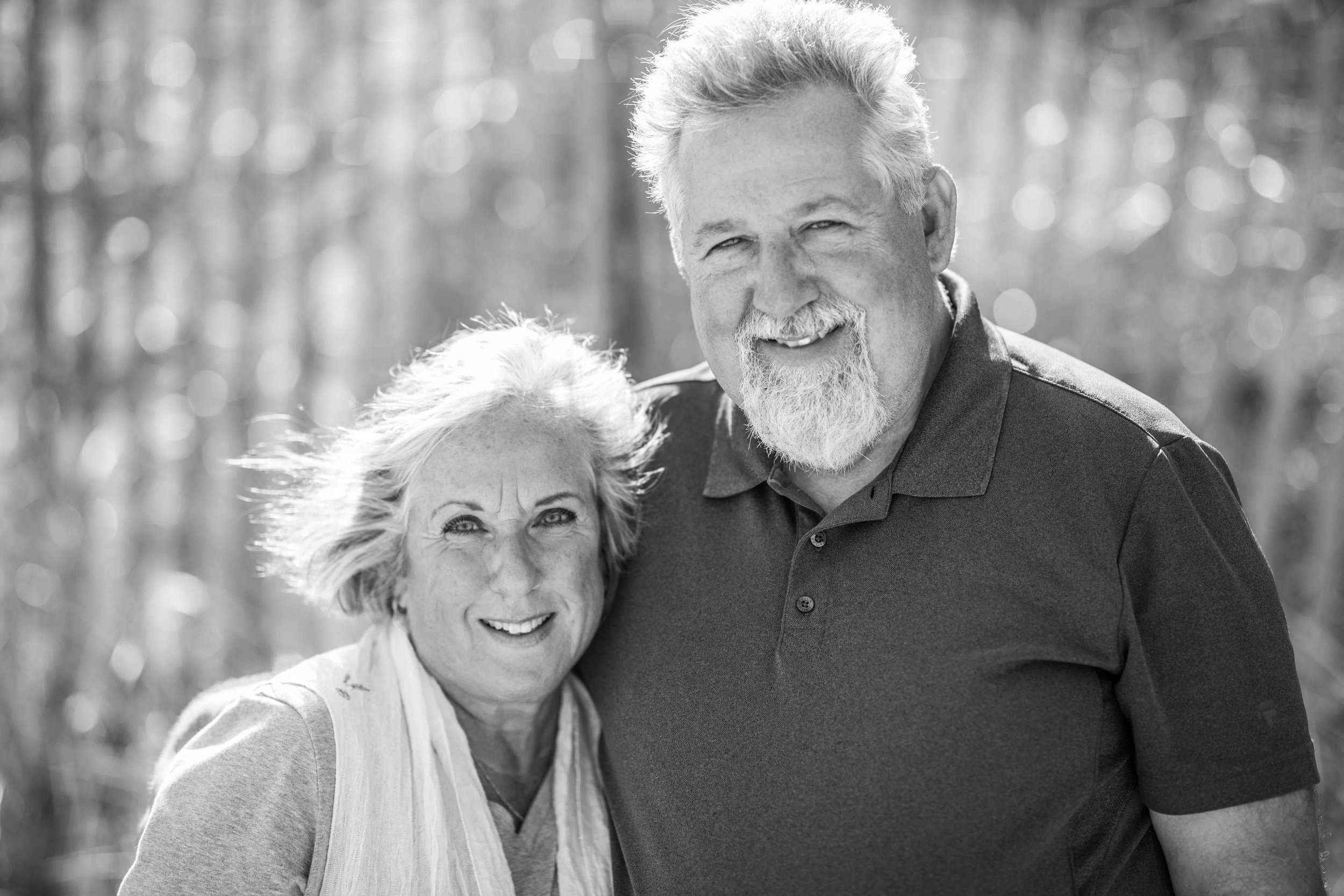  black and white image of smiling grand parents 