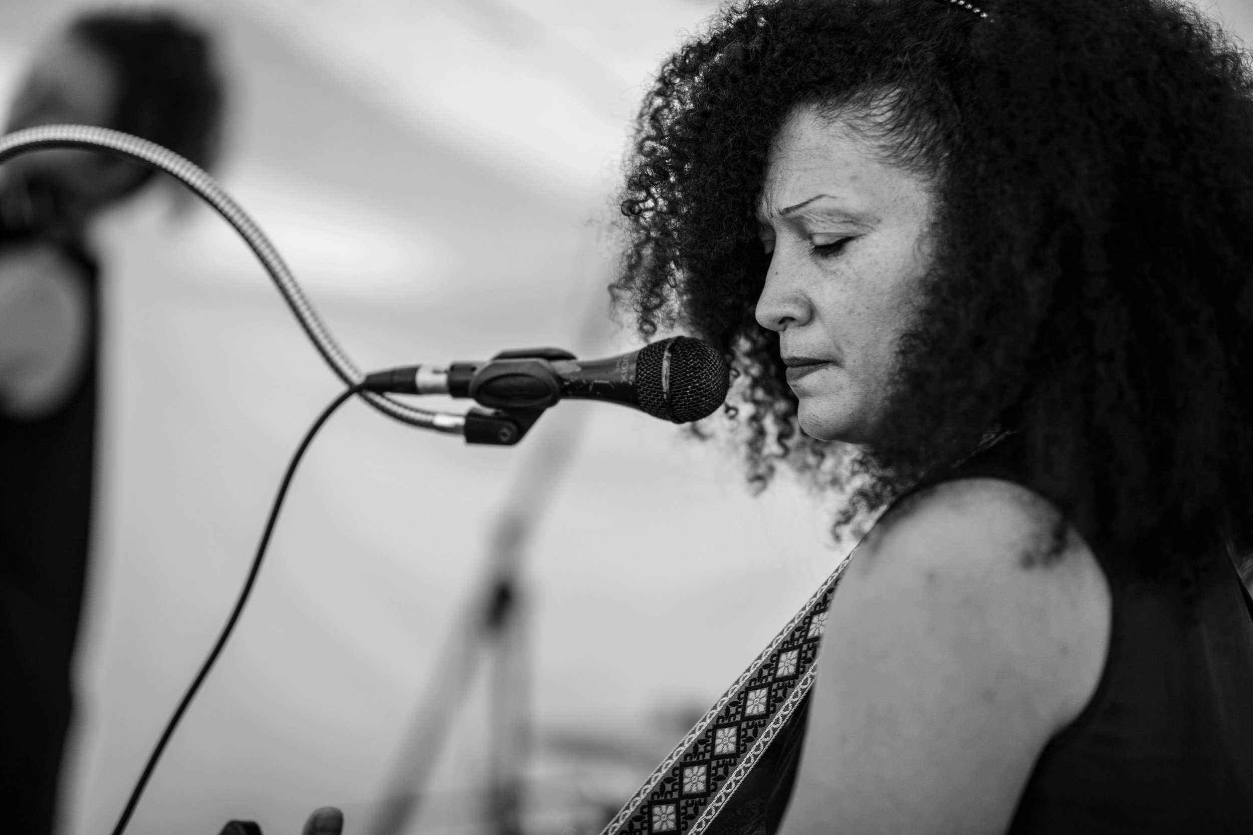  black and white musician in front of microphone  