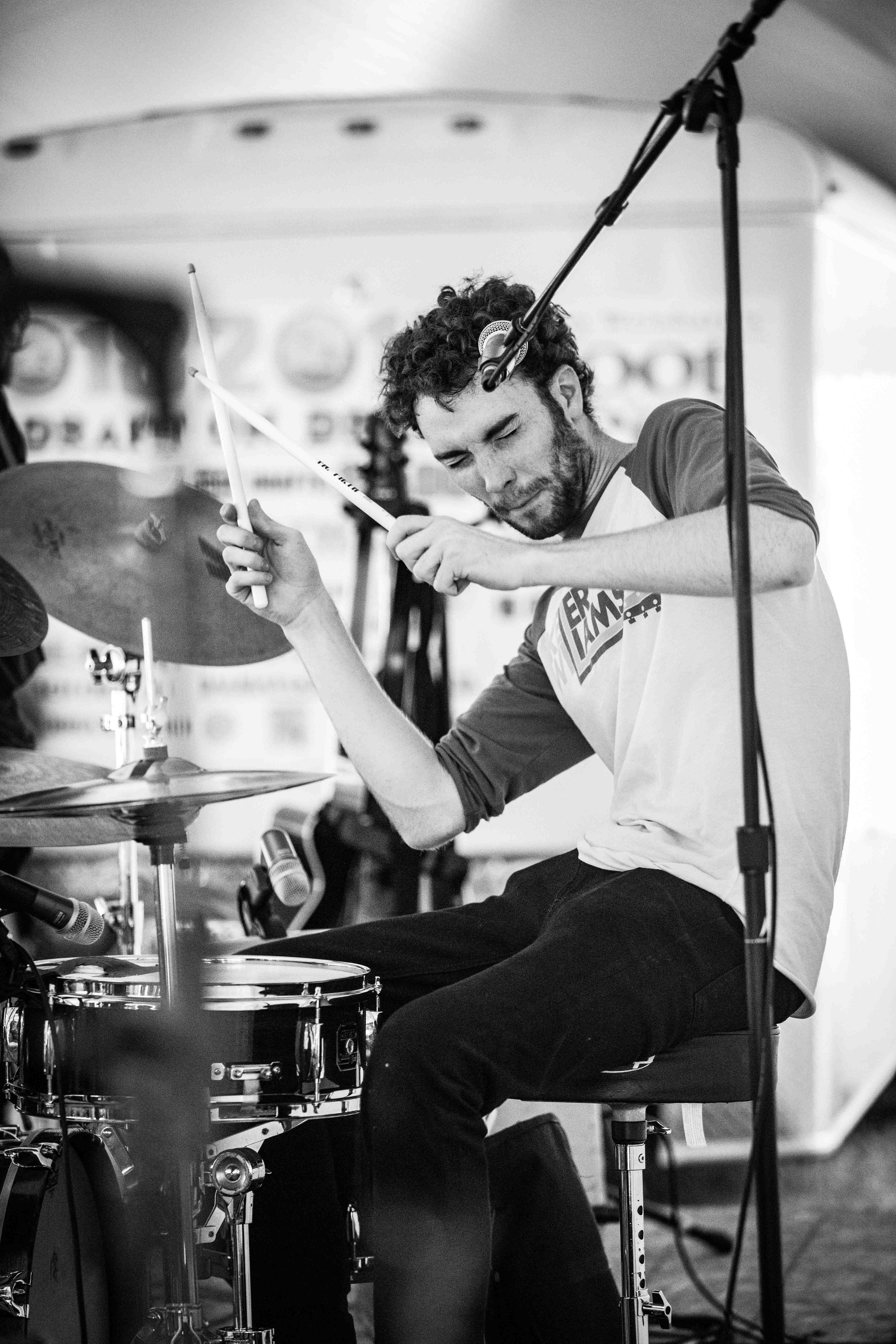  drummer from the Accidentals beating on his drums 