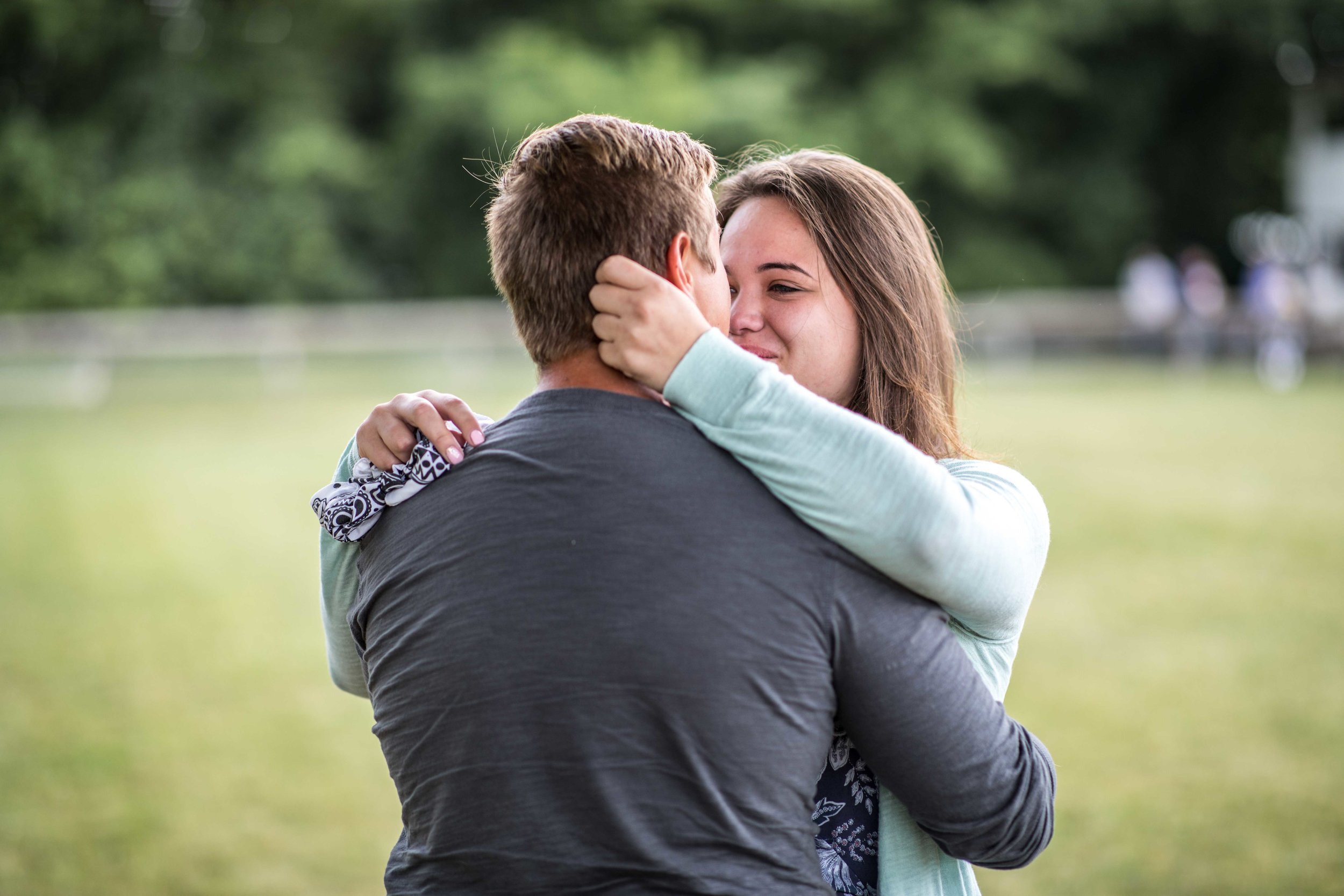  girlfriend hugs her new fiancé  