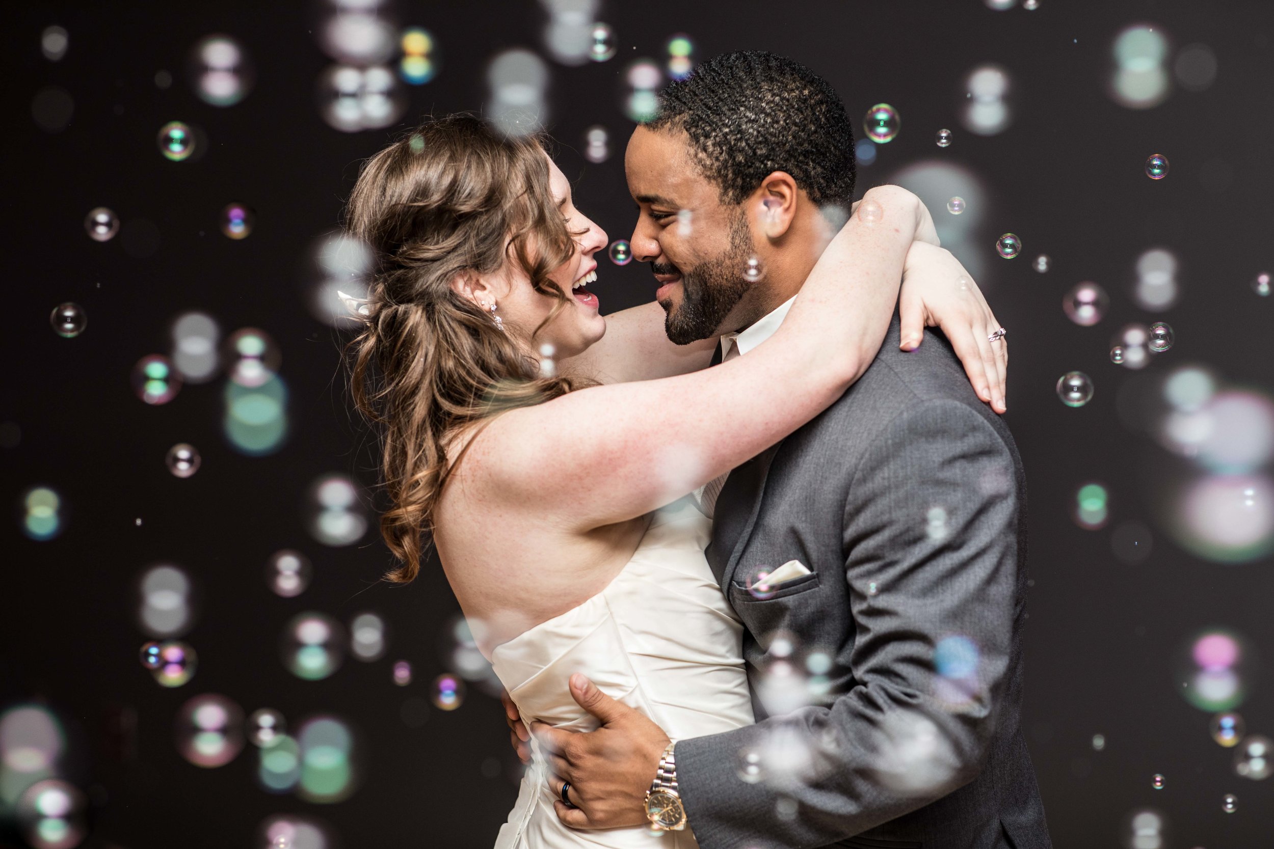  Bubbles fill the dance floor while the bride and groom have their first dance 