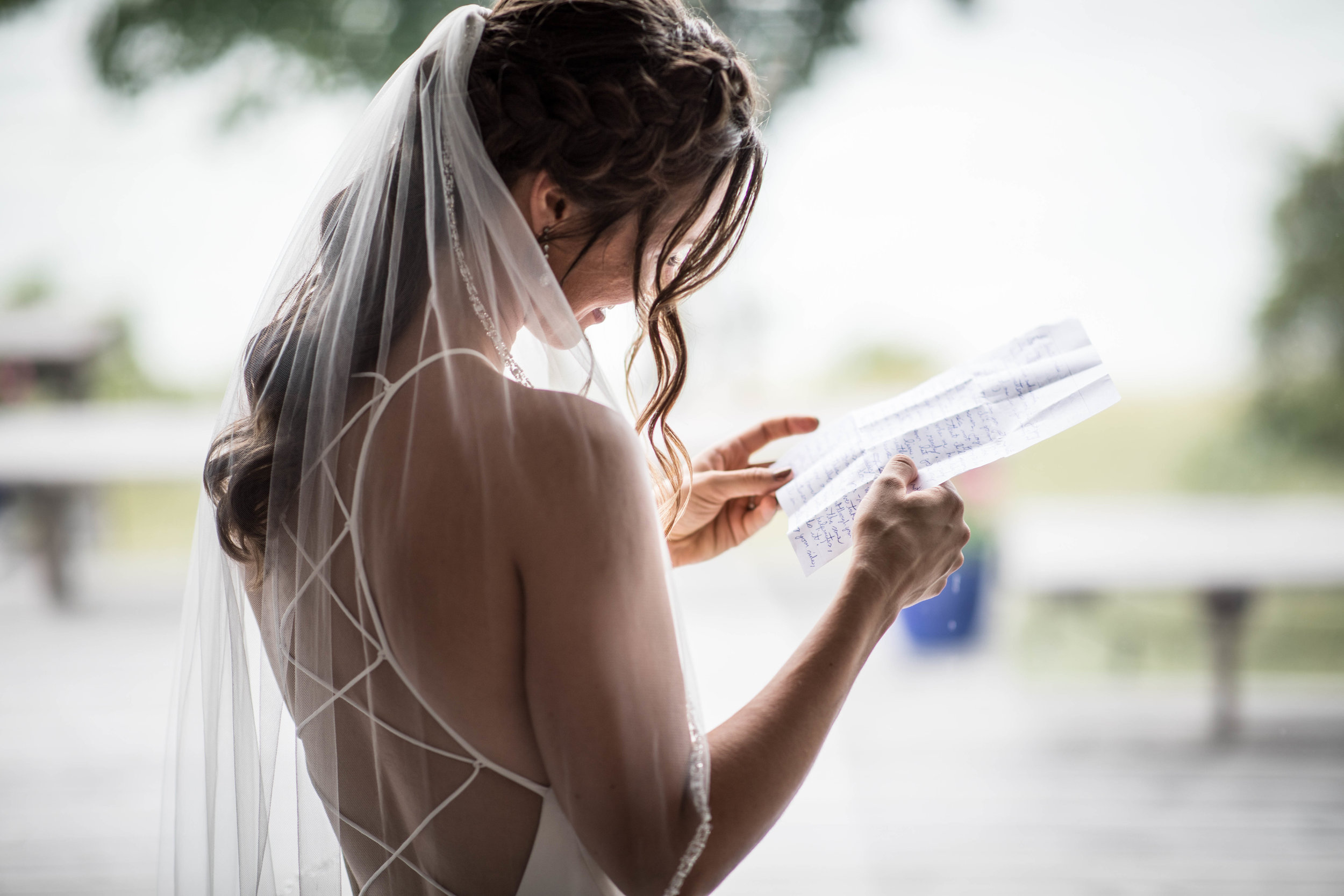  the bride reads a letter from the groom 