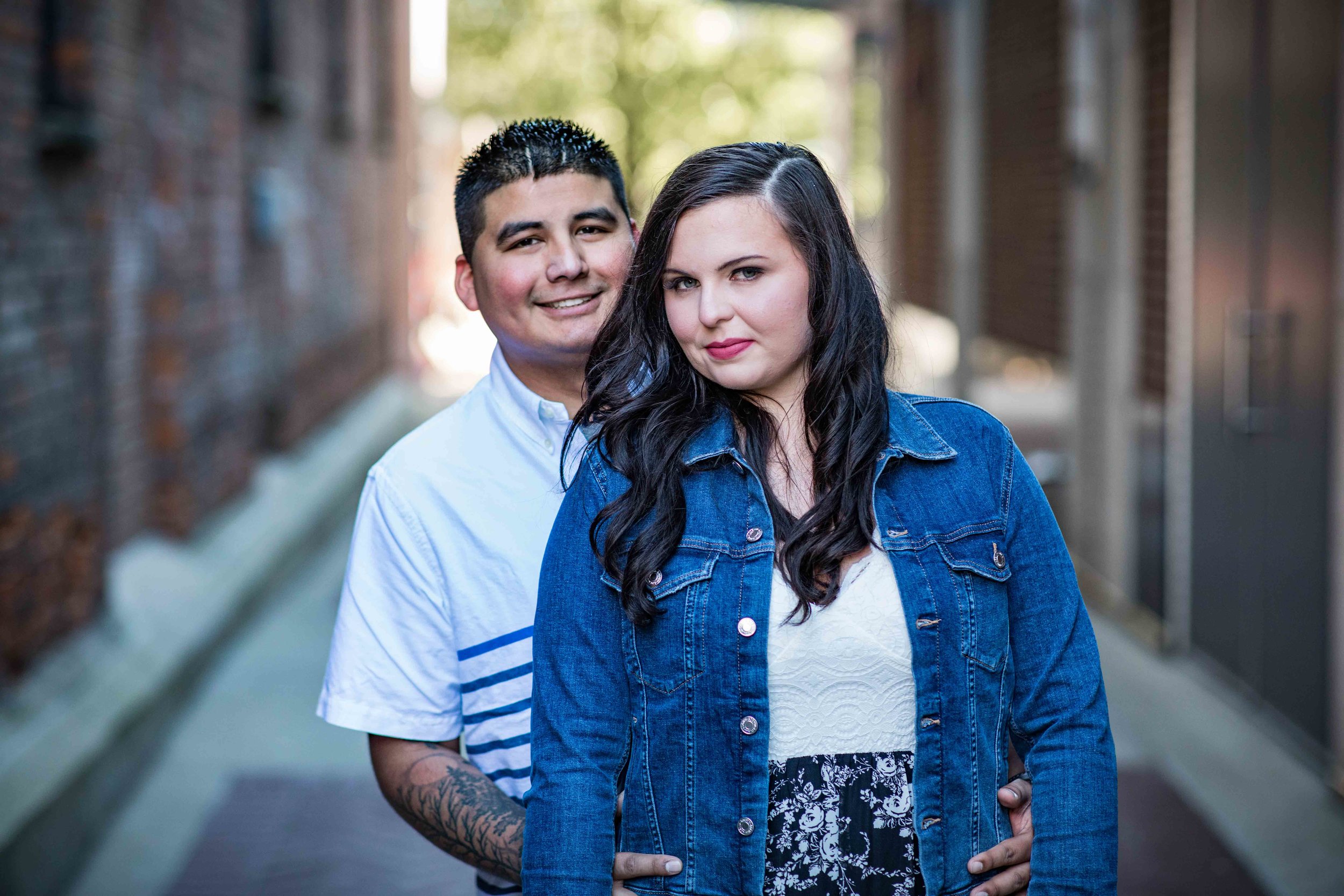  He holds her tight and close as they pose in an alley near the Kalamazoo Mall Dr 