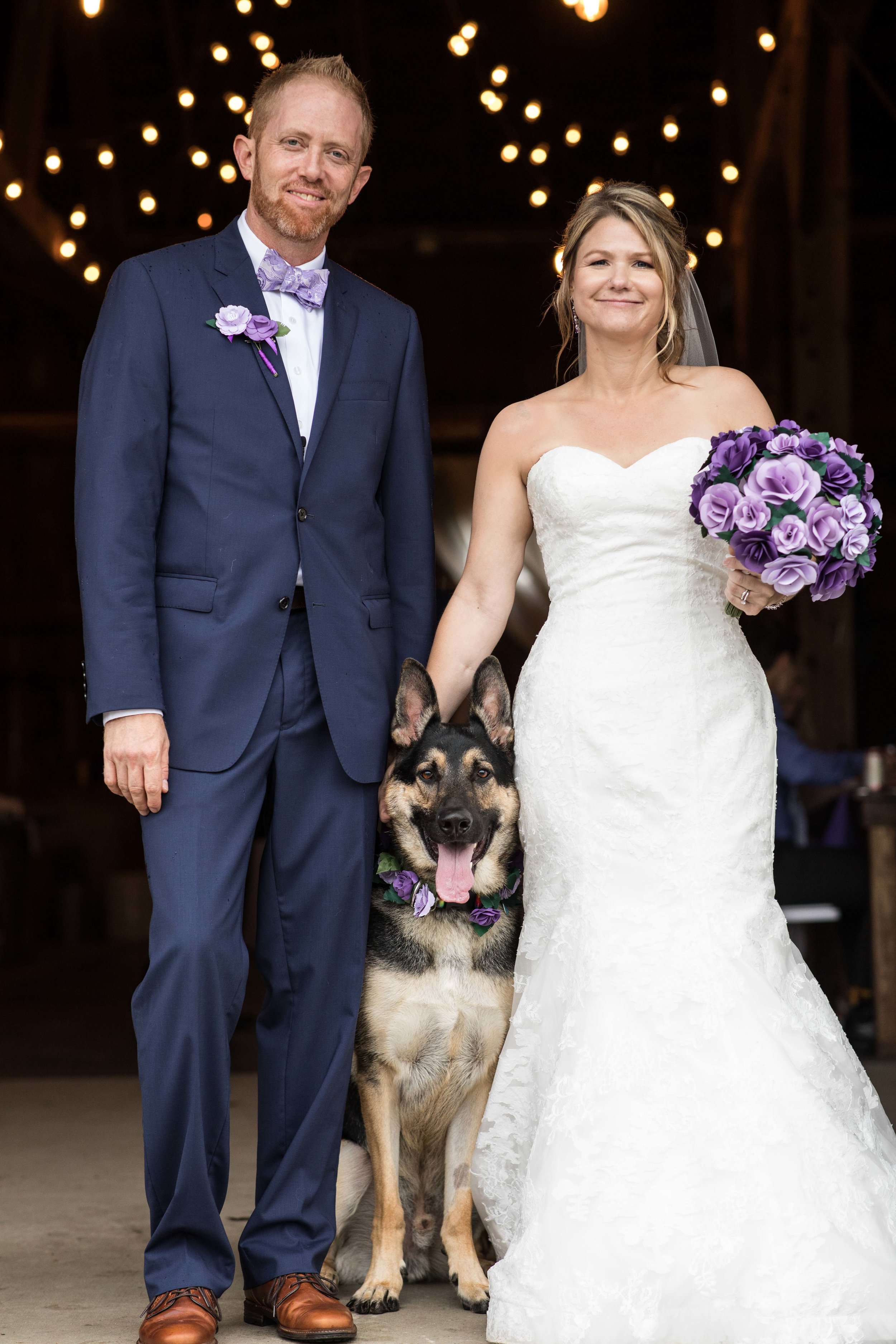  bride and groom with their pup 