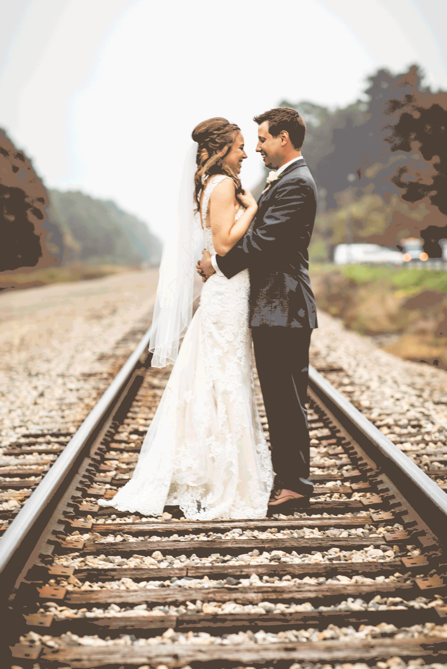 GIF of groom dipping and kissing bride