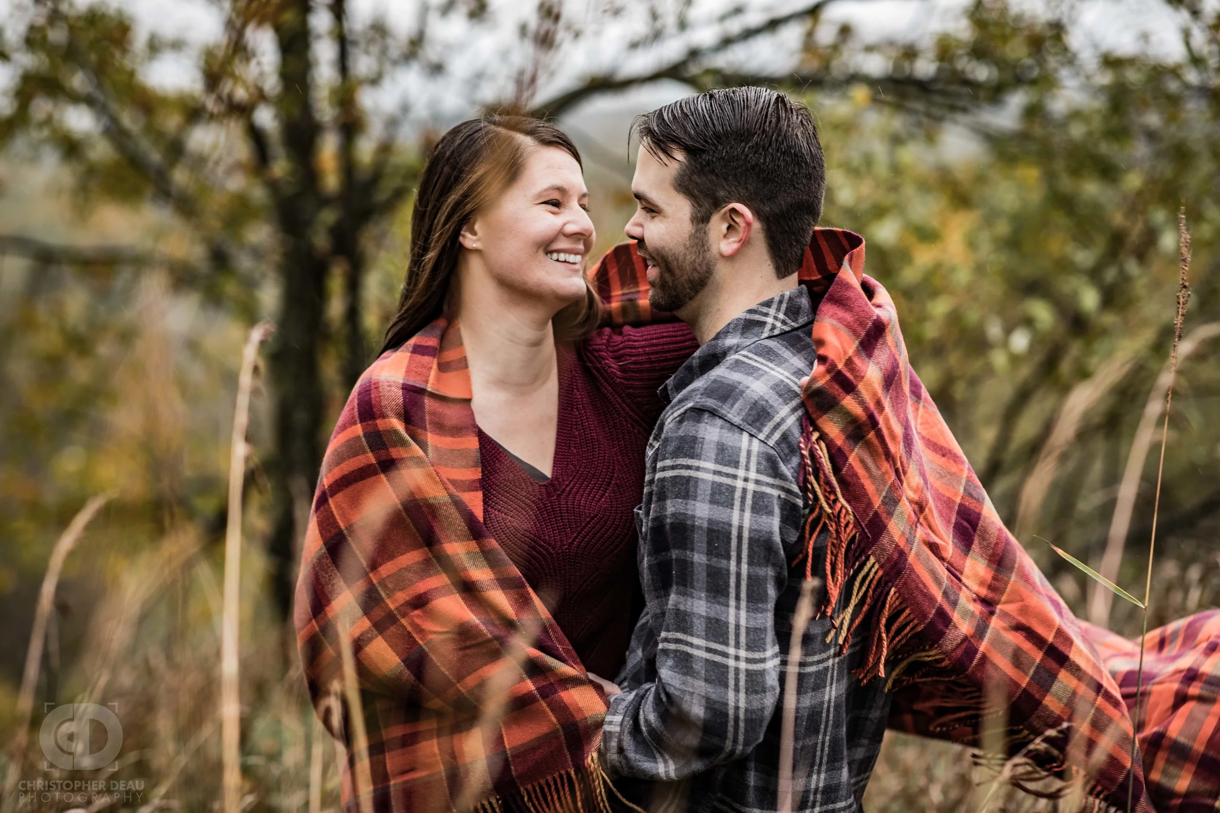 action photo of her throwing a blanket around him