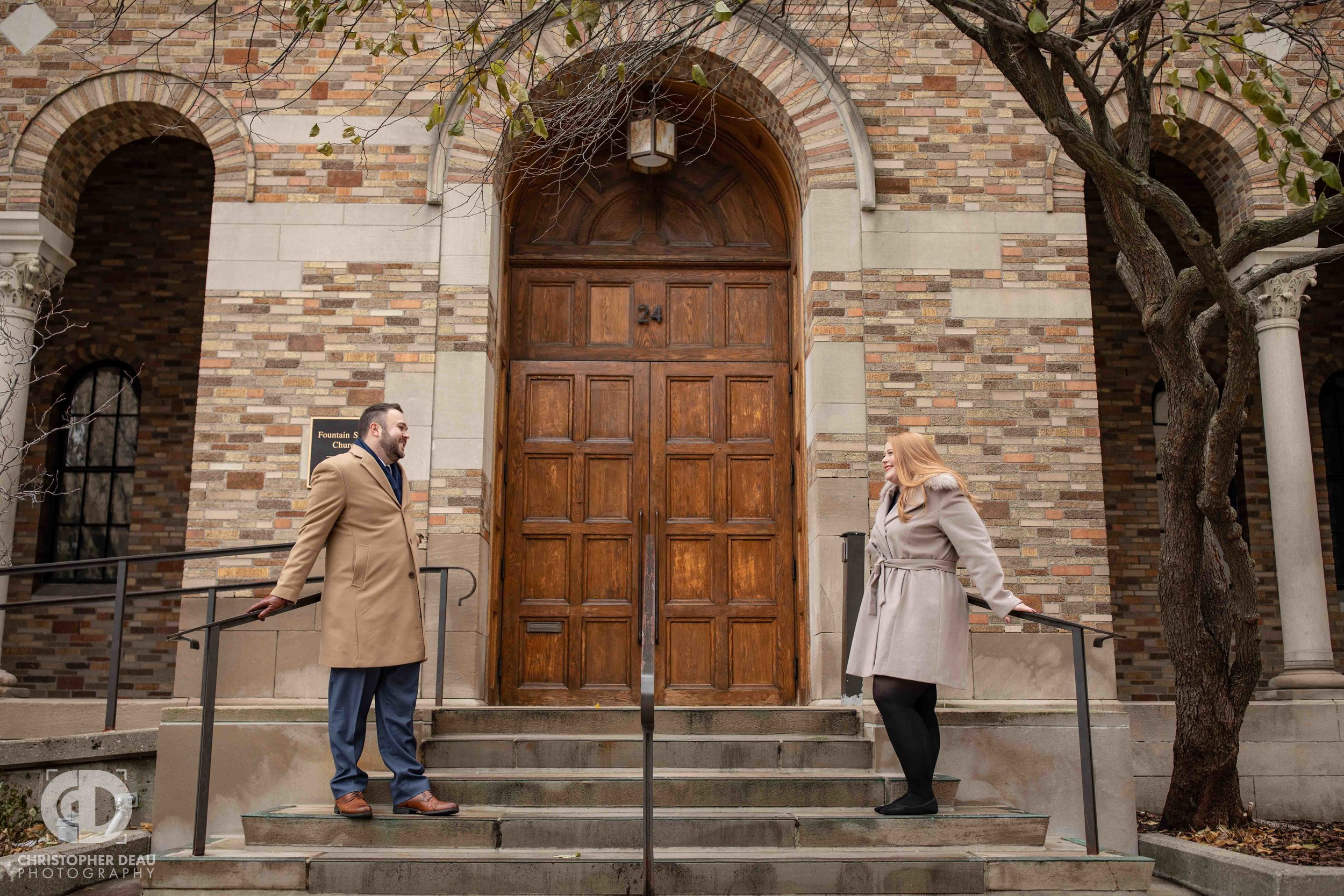  Engagement photos on the steps of the Fountain Street Church in Grand Rapids Michigan 