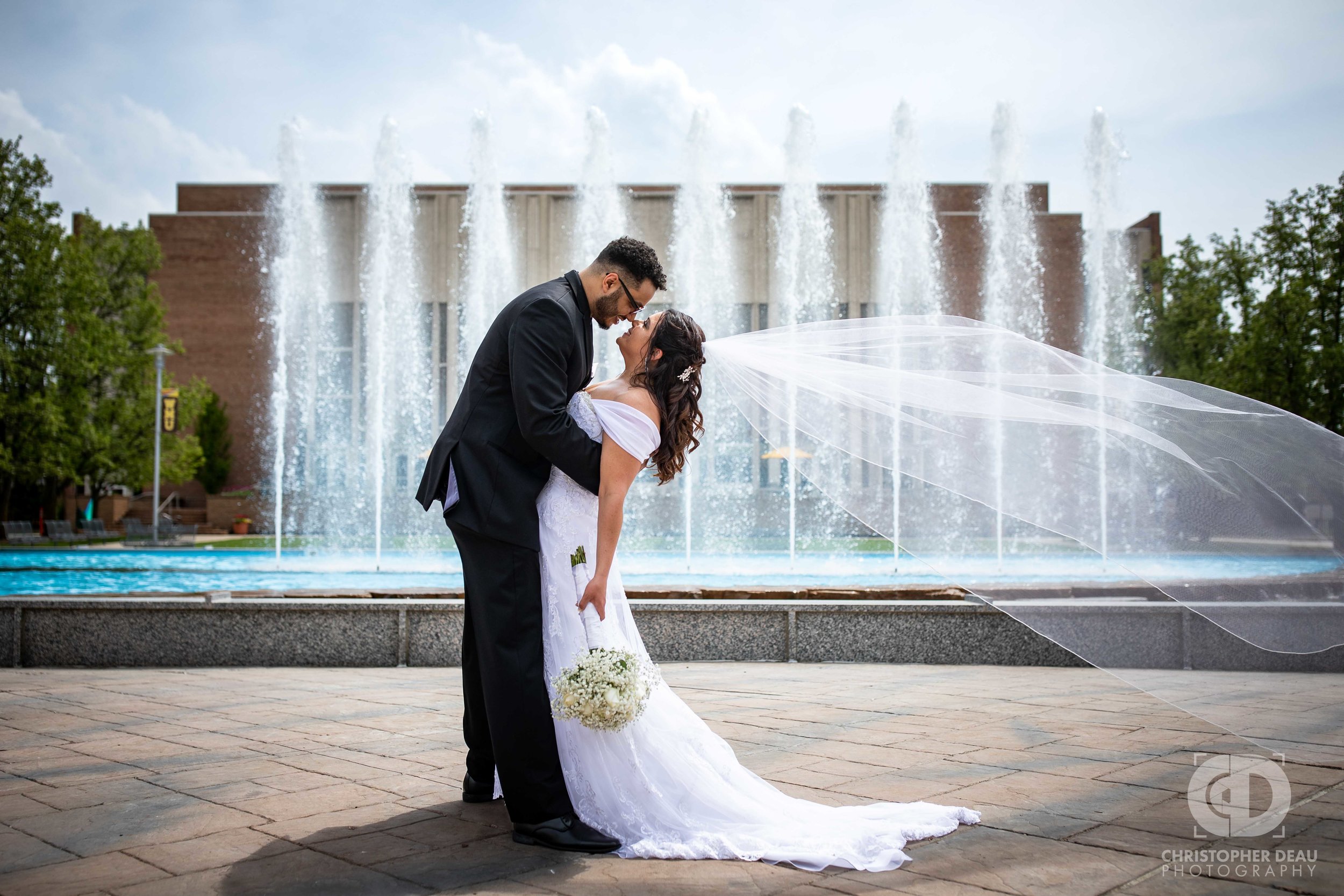  Bride and Groom portrait in front of fountain behind Miller auditorium on Western Michigan University campus 